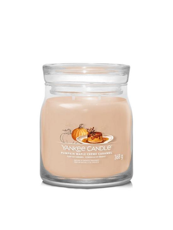 front image of yankee-candle-signature-pumpkin-maple-cregraveme-caramel-medium-jar-candle