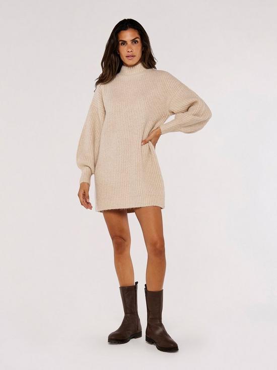 front image of apricot-chunky-knit-puff-sleeve-jumper-dress