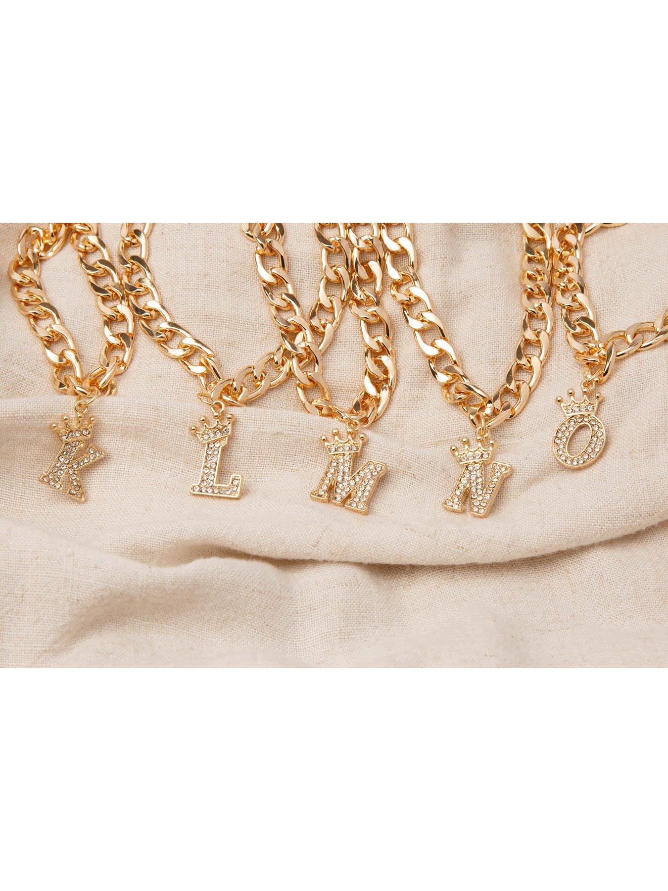 image of the-love-collection-gold-plated-crystal-letter-charm-curb-bracelet