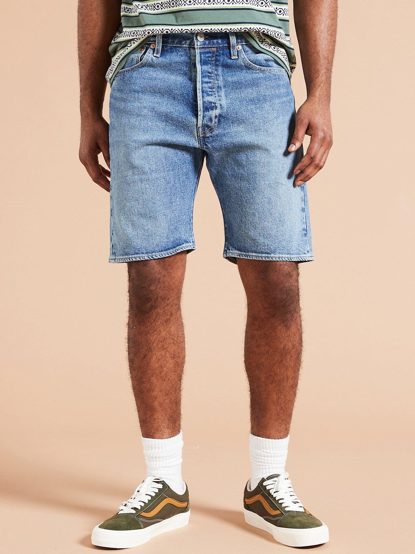 Levi's 501 mid thigh shorts in midwash blue