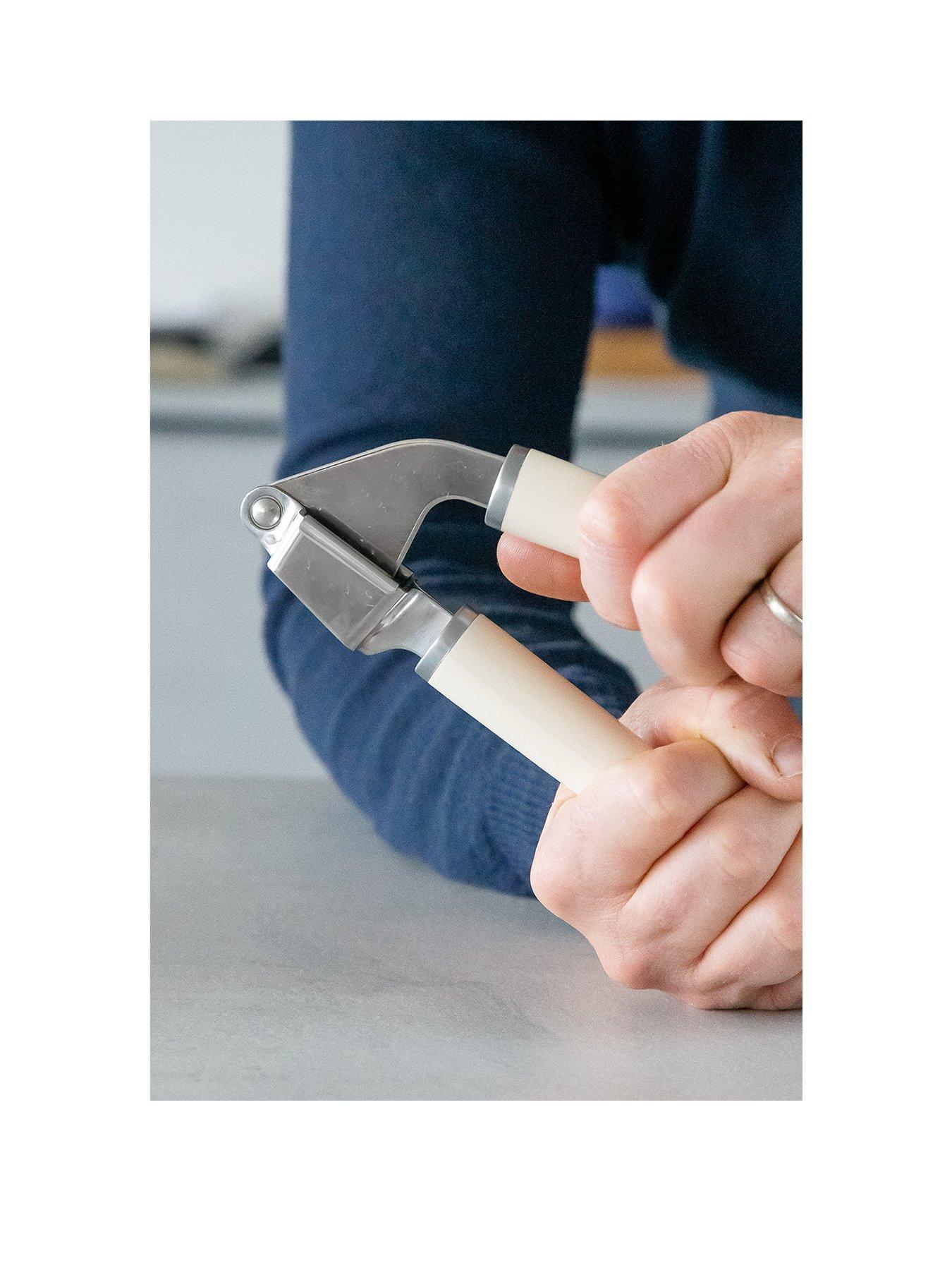  image of kitchenaid-stainless-steel-garlic-press-almond-cream