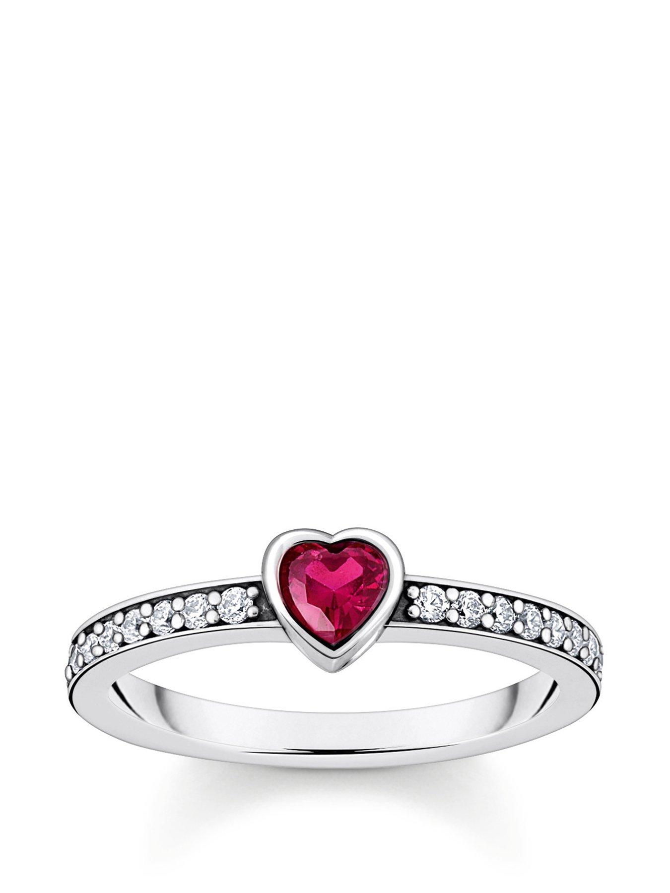 undefined Solitaire Heart Ring: Sparkling romance with red heart-cut stone, white zirconia band, FOLLOW YOUR HEART engraving