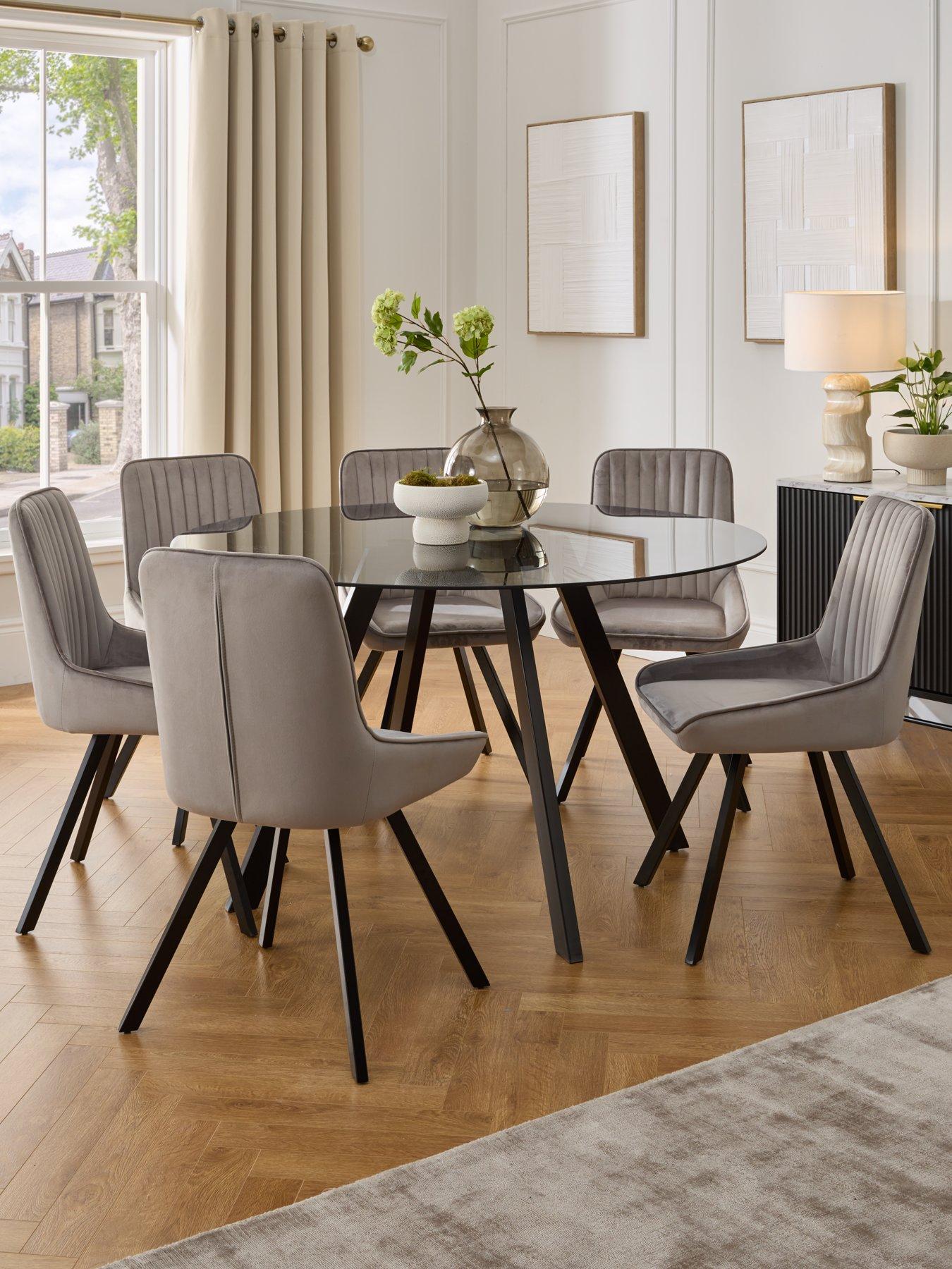 The Very Collection Marlow 130 cm Round Smoked Glass Top Dining Table and 6 Fabric Chairs - Grey/Black