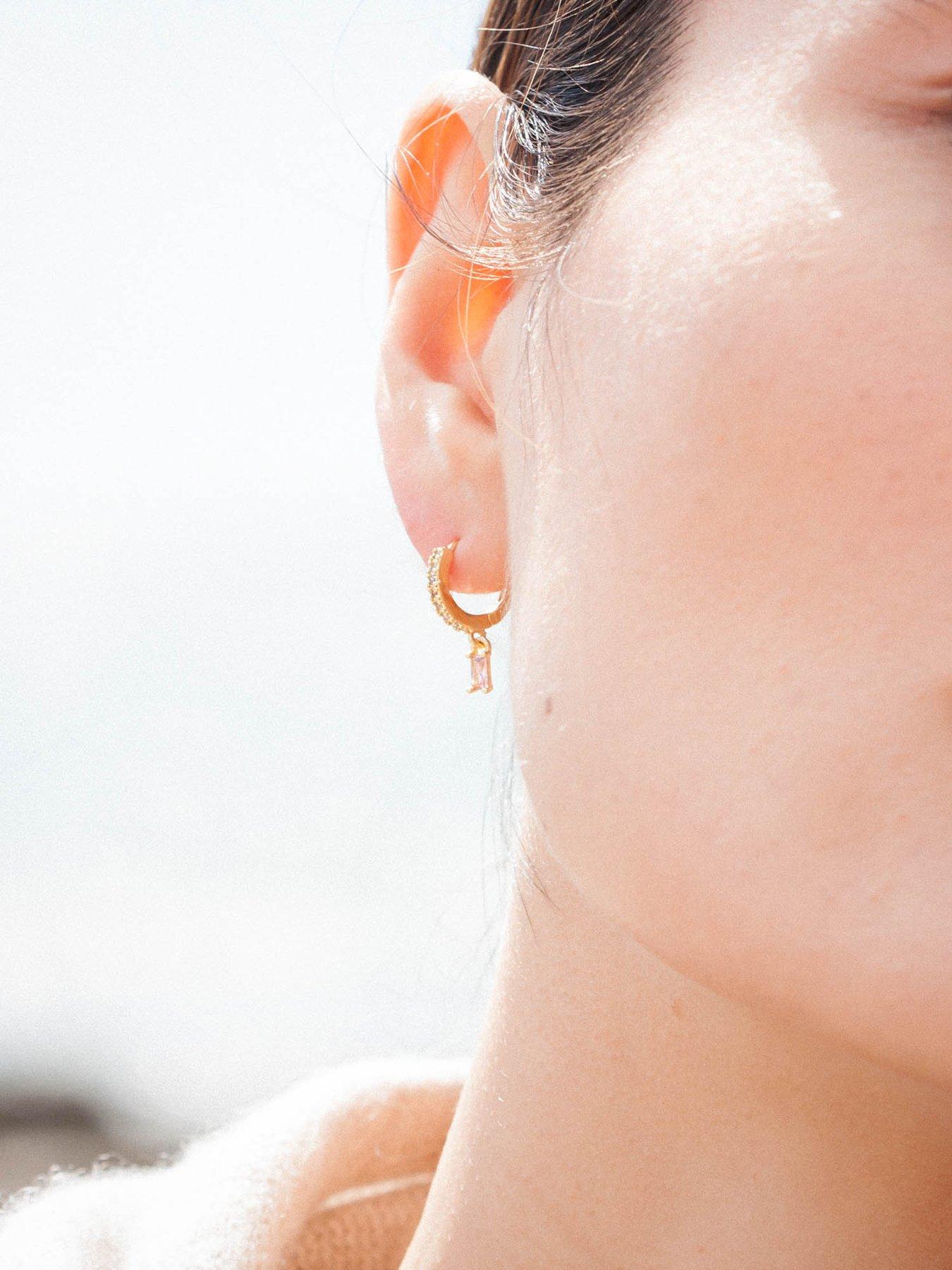  image of the-love-collection-pink-rectangle-dropper-huggie-hoops