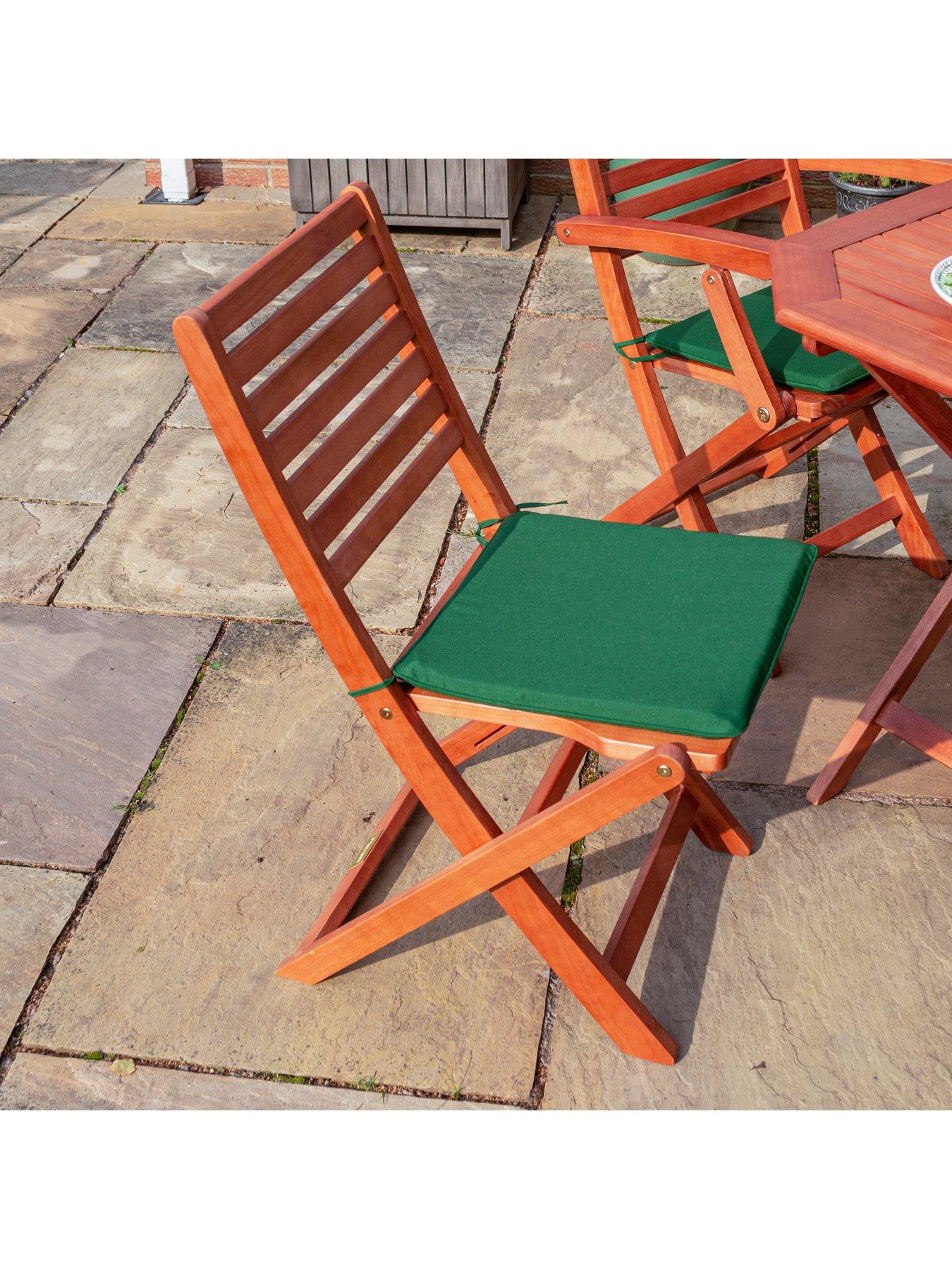  image of rowlinson-plumley-6-seater-dining-set-withnbspgreen-cushions