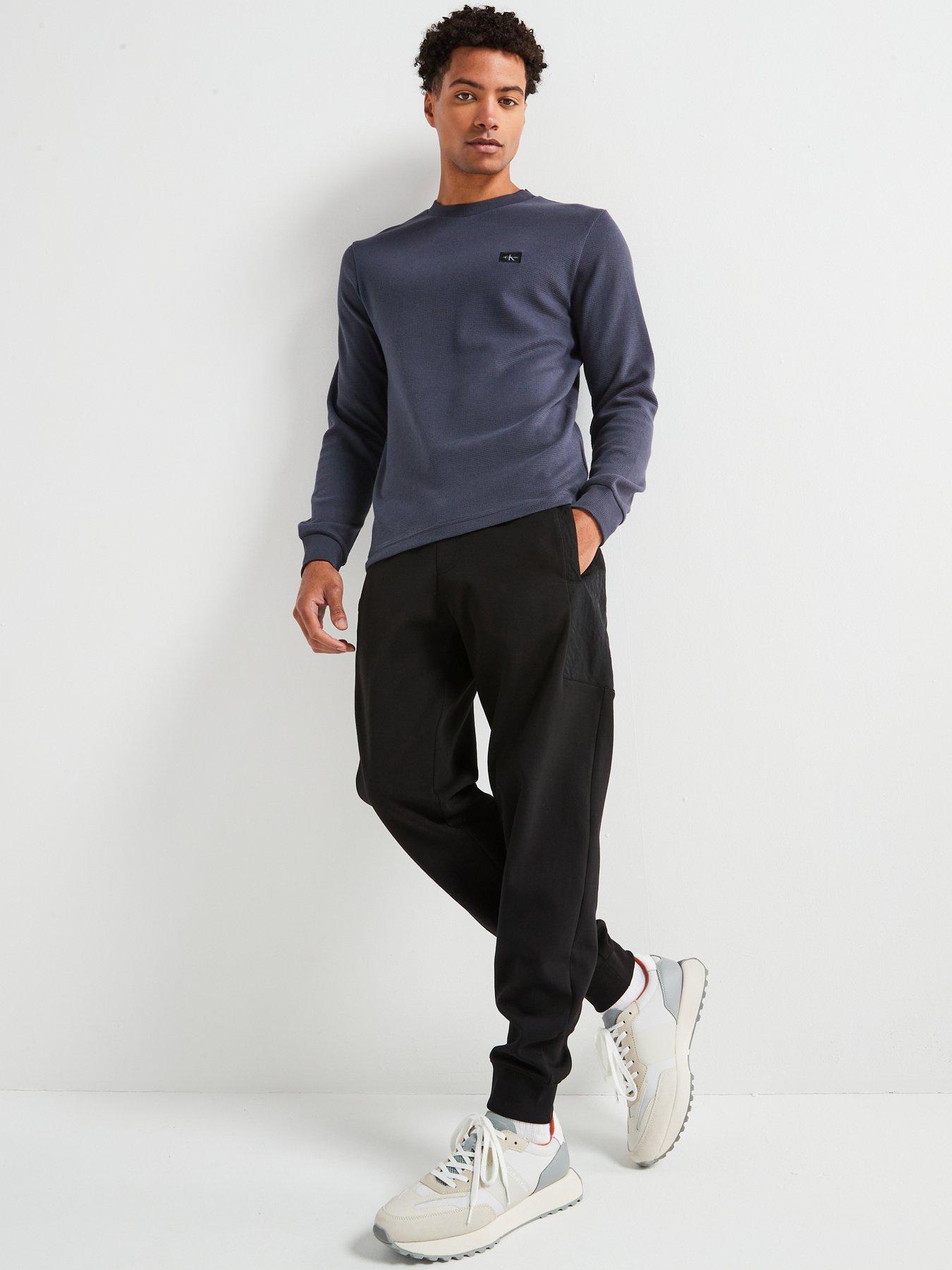  image of calvin-klein-jeans-woven-label-waffle-long-sleeve-t-shirt-navy