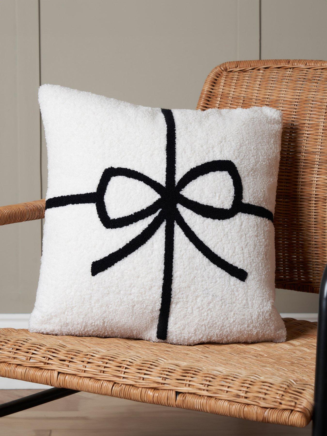  image of very-home-christmas-bow-tufted-cushion