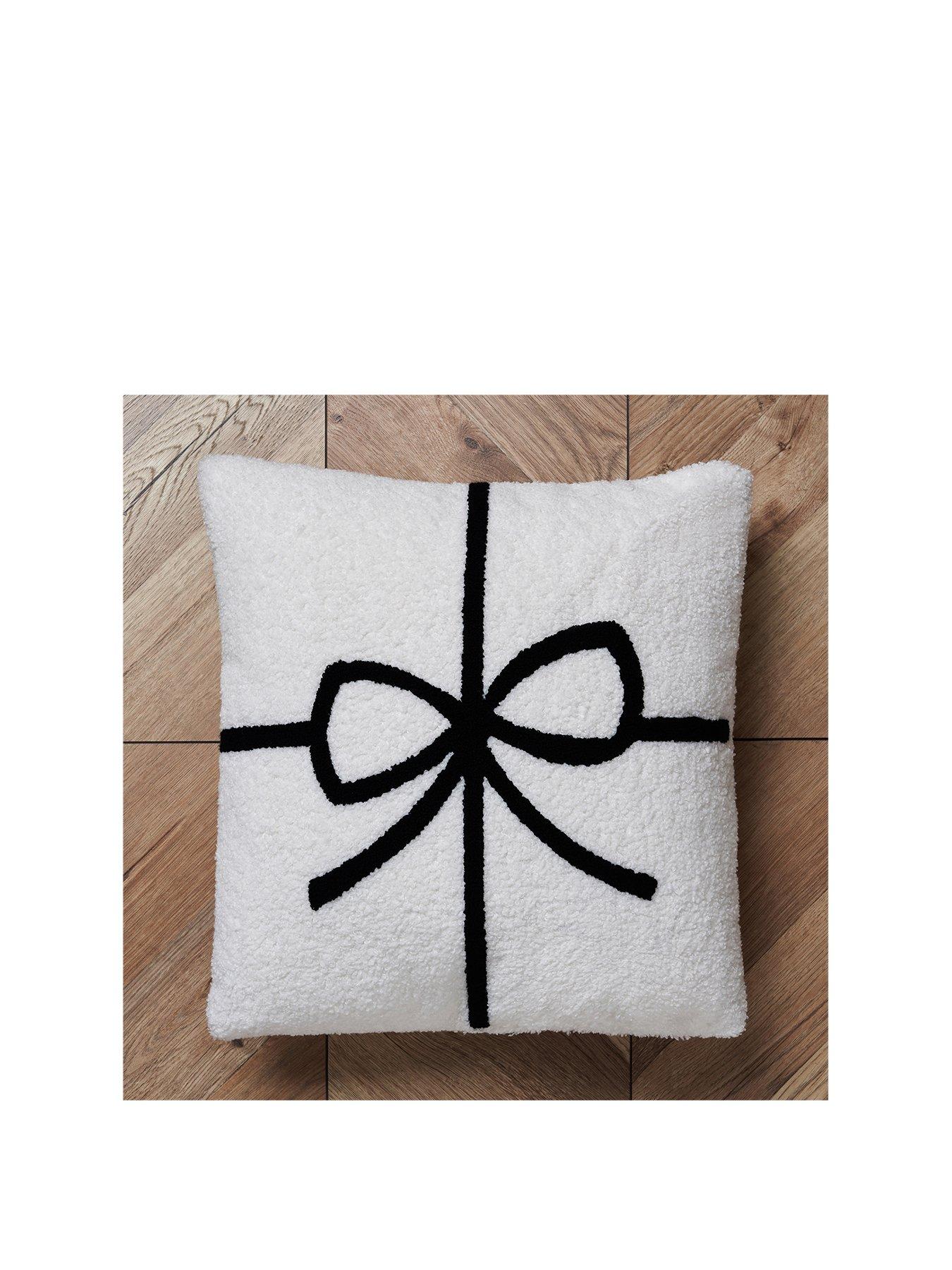  image of very-home-christmas-bow-tufted-cushion