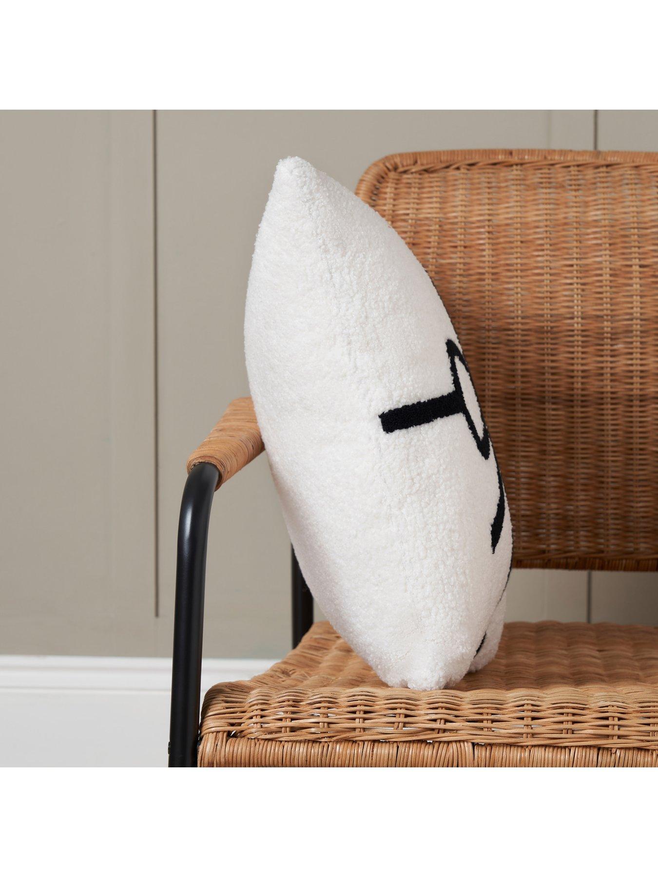  image of very-home-christmas-bow-tufted-cushion