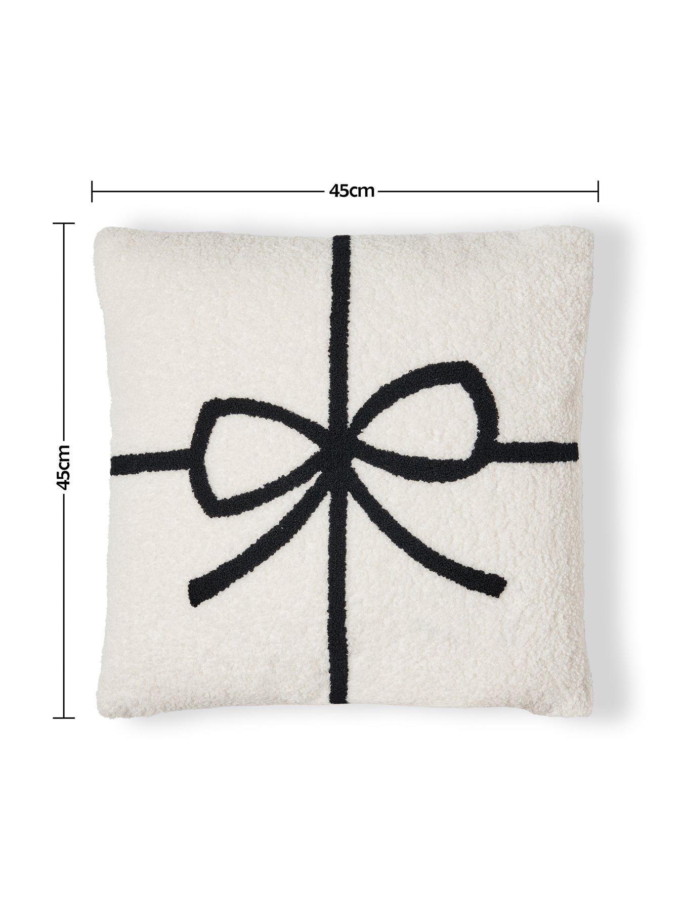  image of very-home-christmas-bow-tufted-cushion