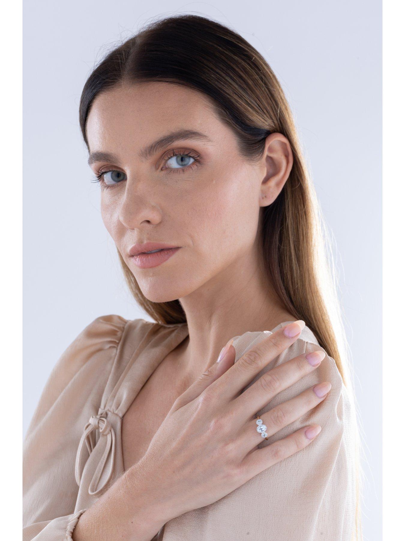  image of love-diamond-aquamarine-look-sky-blue-topaz-diamond-halo-ring