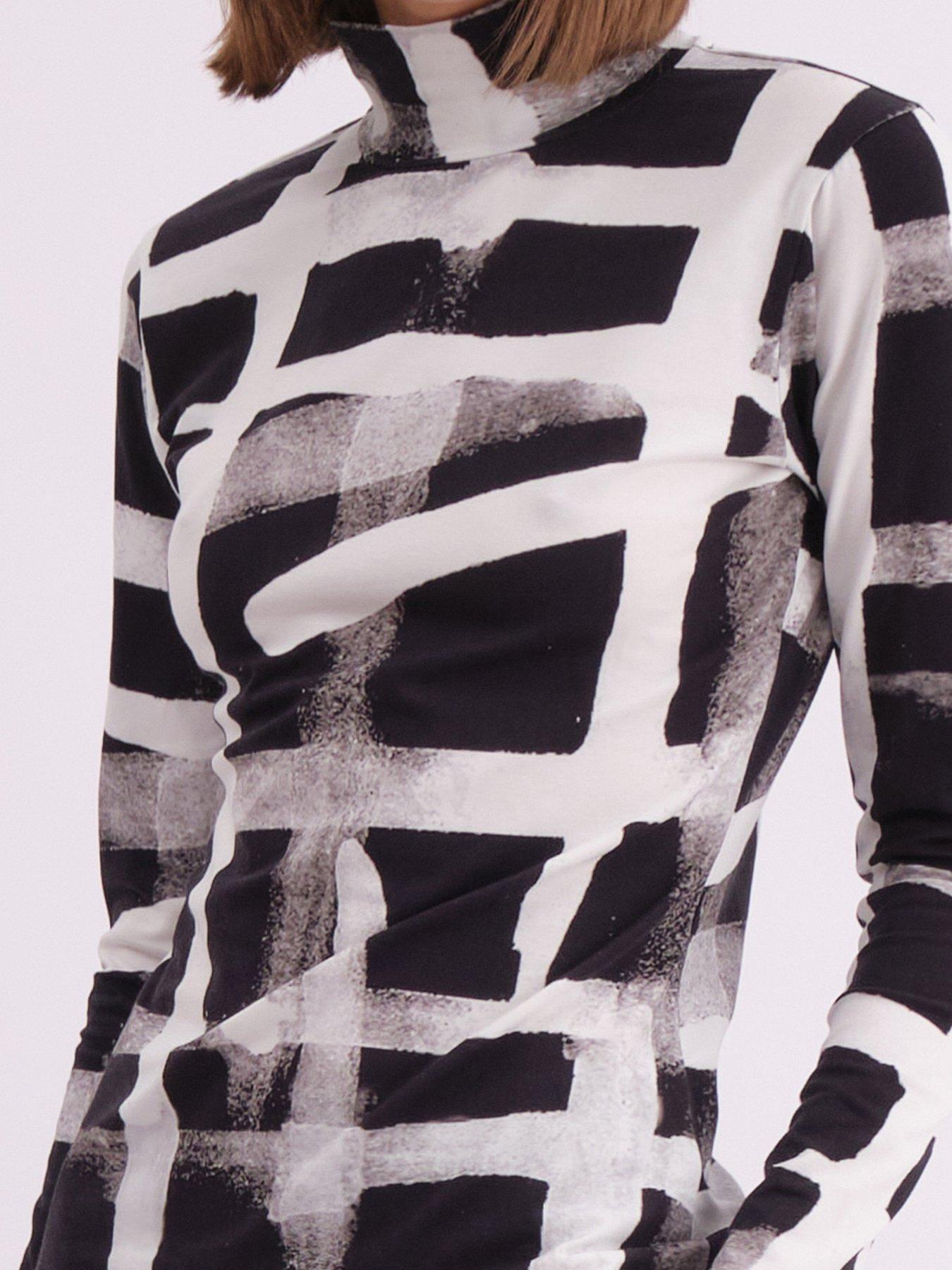  image of religion-edge-roll-neck-top-in-abstract-monochrome-hero-print