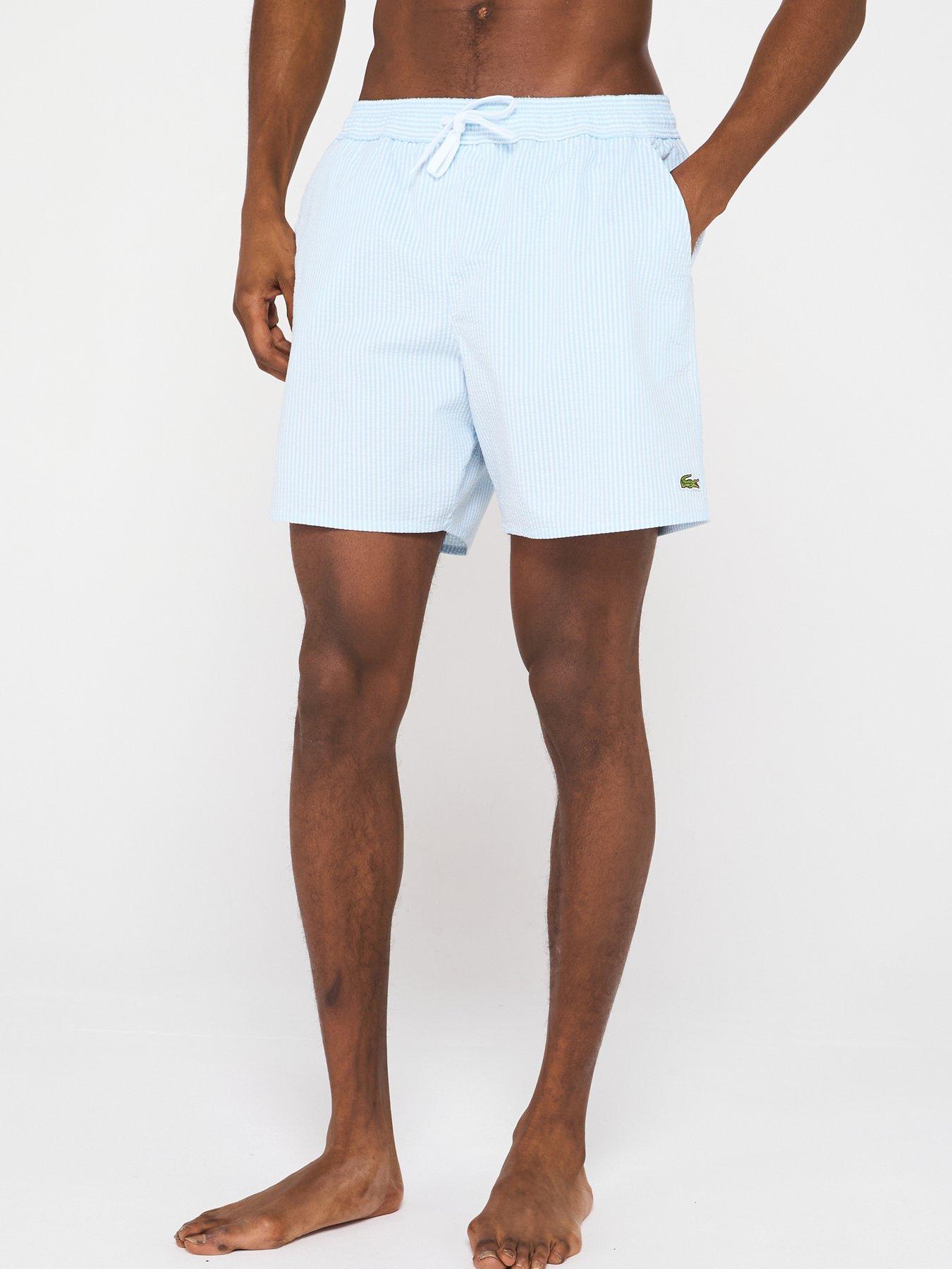 front image of lacoste-striped-seersucker-swim-trunks-blue