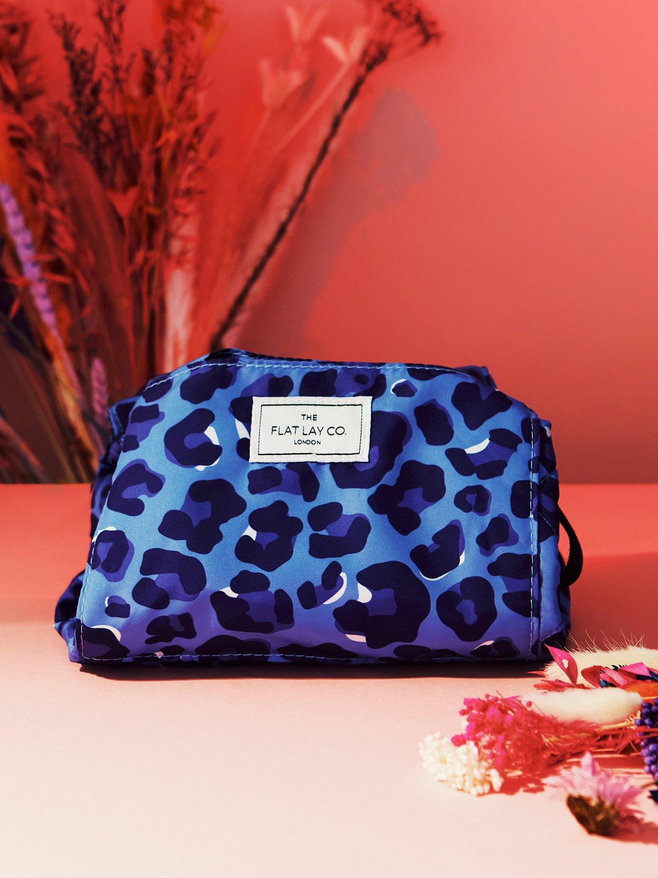  image of the-flat-lay-co-drawstring-makeup-bag-in-blue-leopard