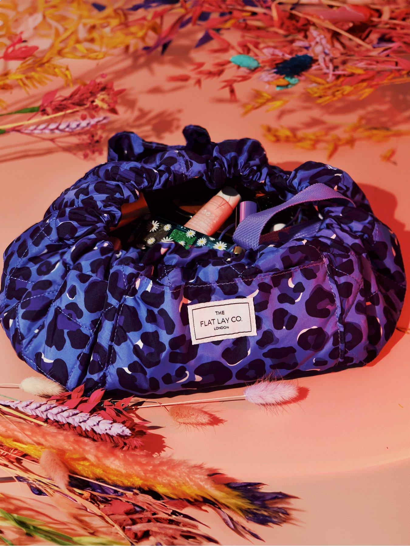  image of the-flat-lay-co-drawstring-makeup-bag-in-blue-leopard