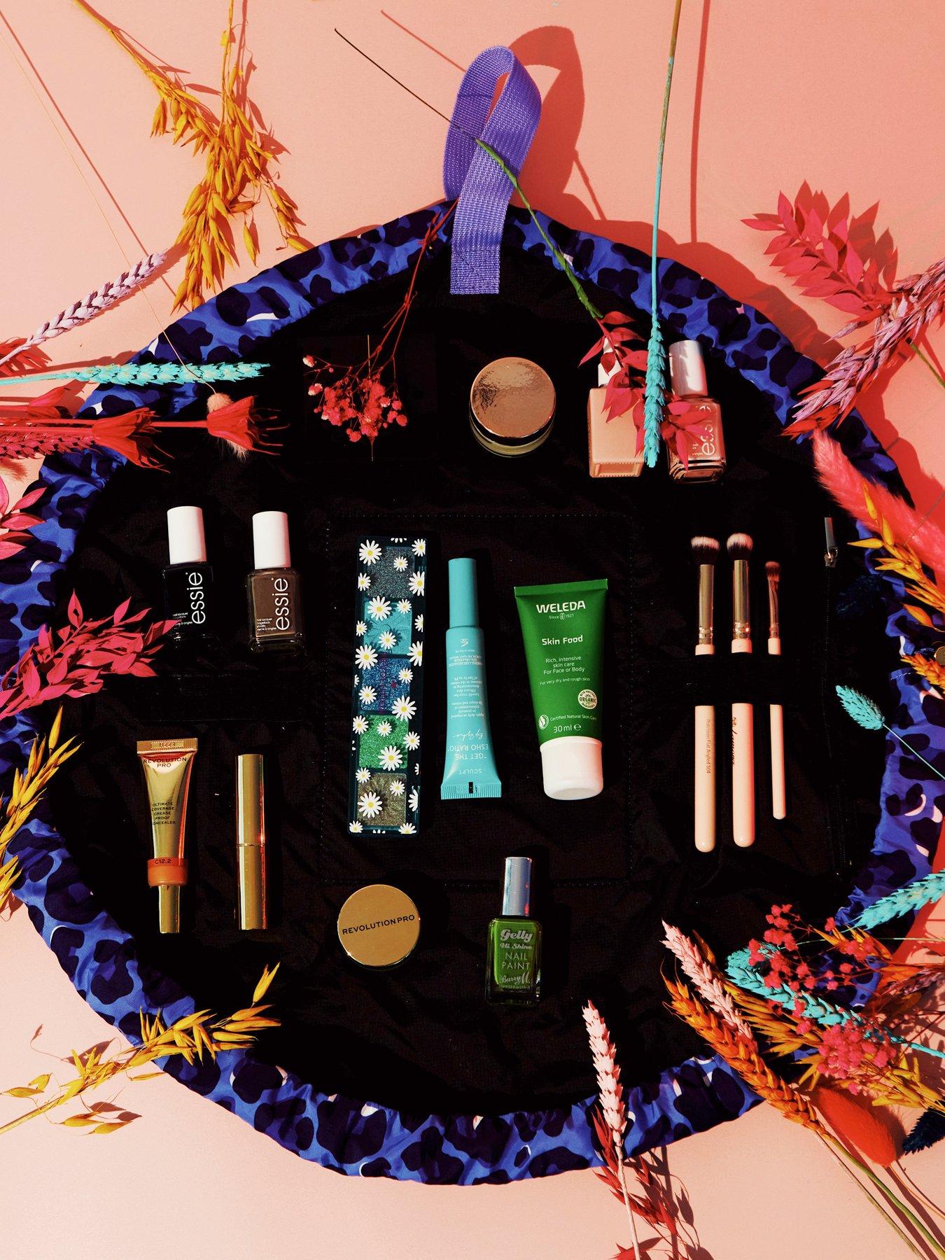  image of the-flat-lay-co-drawstring-makeup-bag-in-blue-leopard