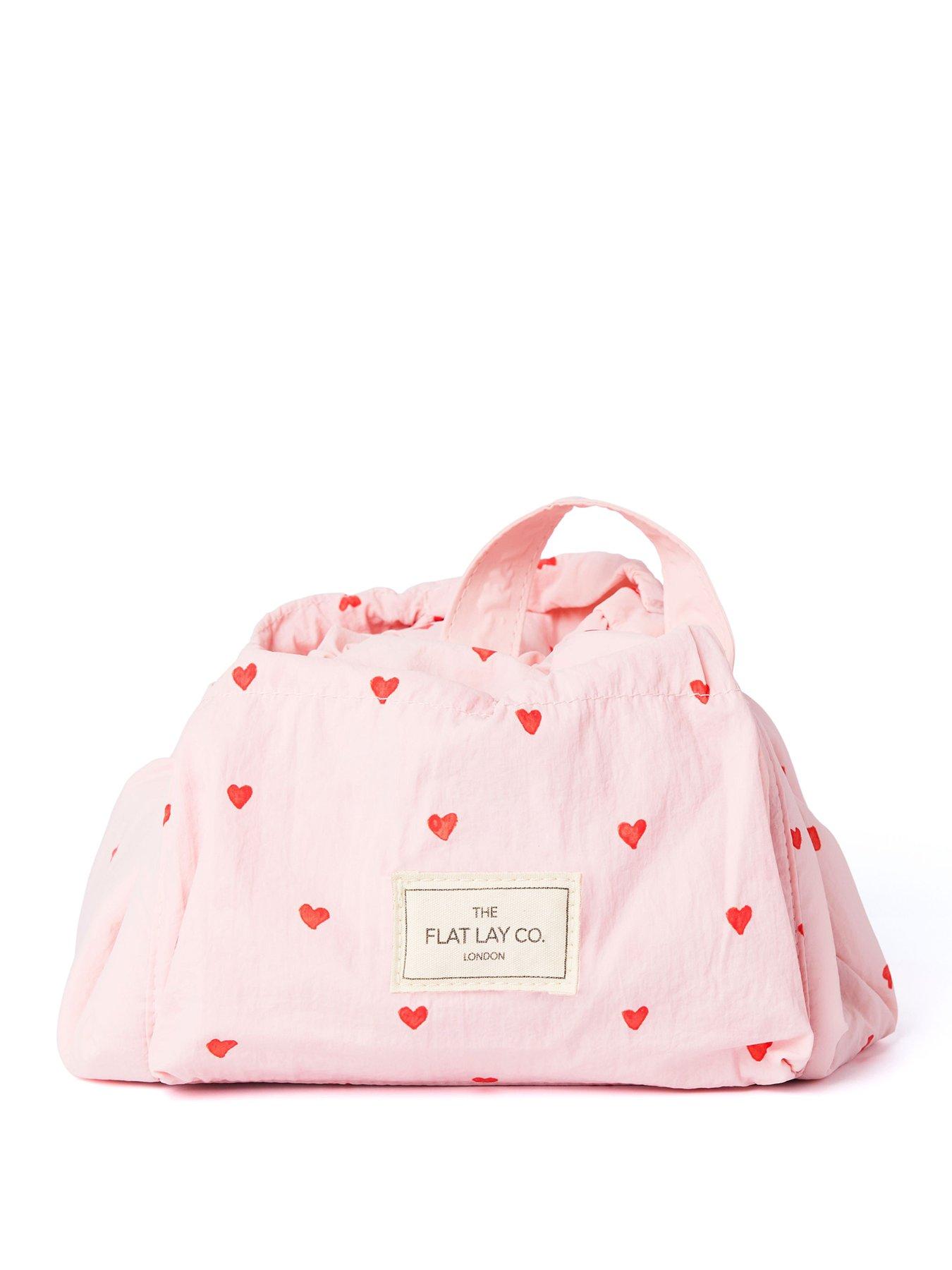 The Flat Lay Co. Marshmallow Drawstring Makeup Bag in Pink Hearts