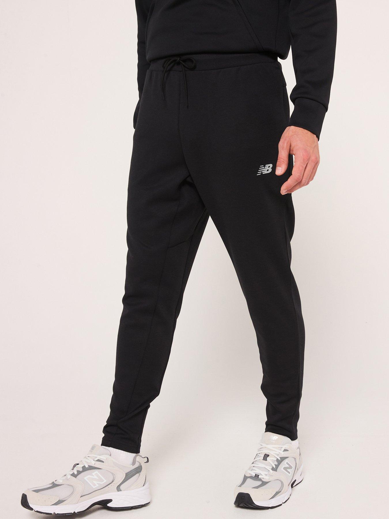  image of new-balance-mens-running-tech-knit-pants-black