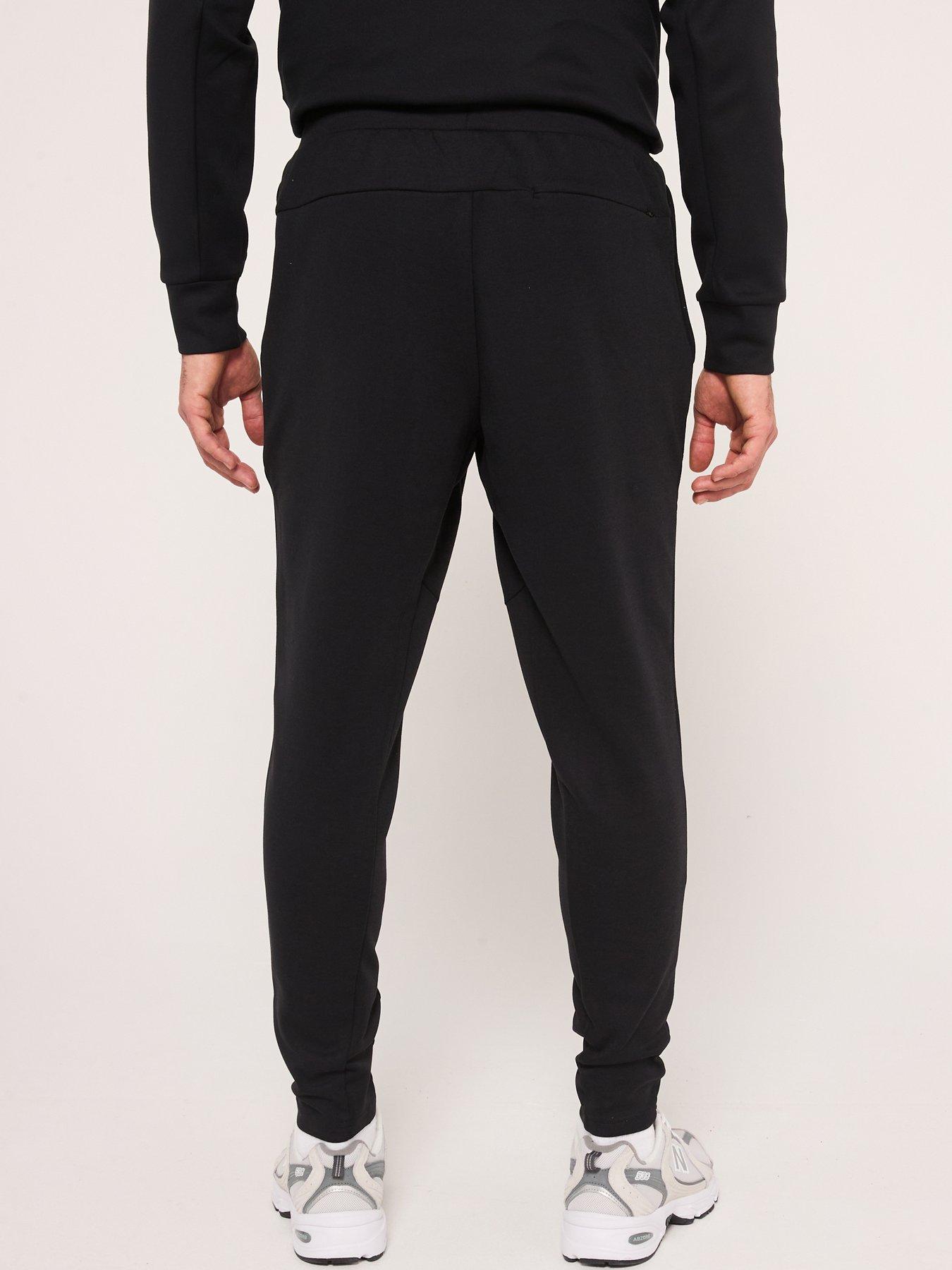  image of new-balance-mens-running-tech-knit-pants-black