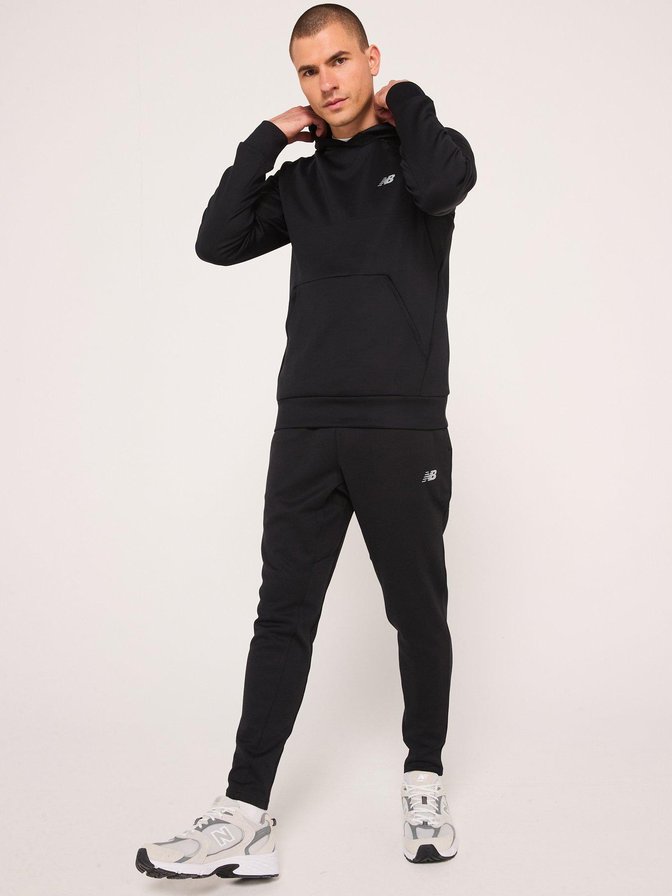  image of new-balance-mens-running-tech-knit-pants-black
