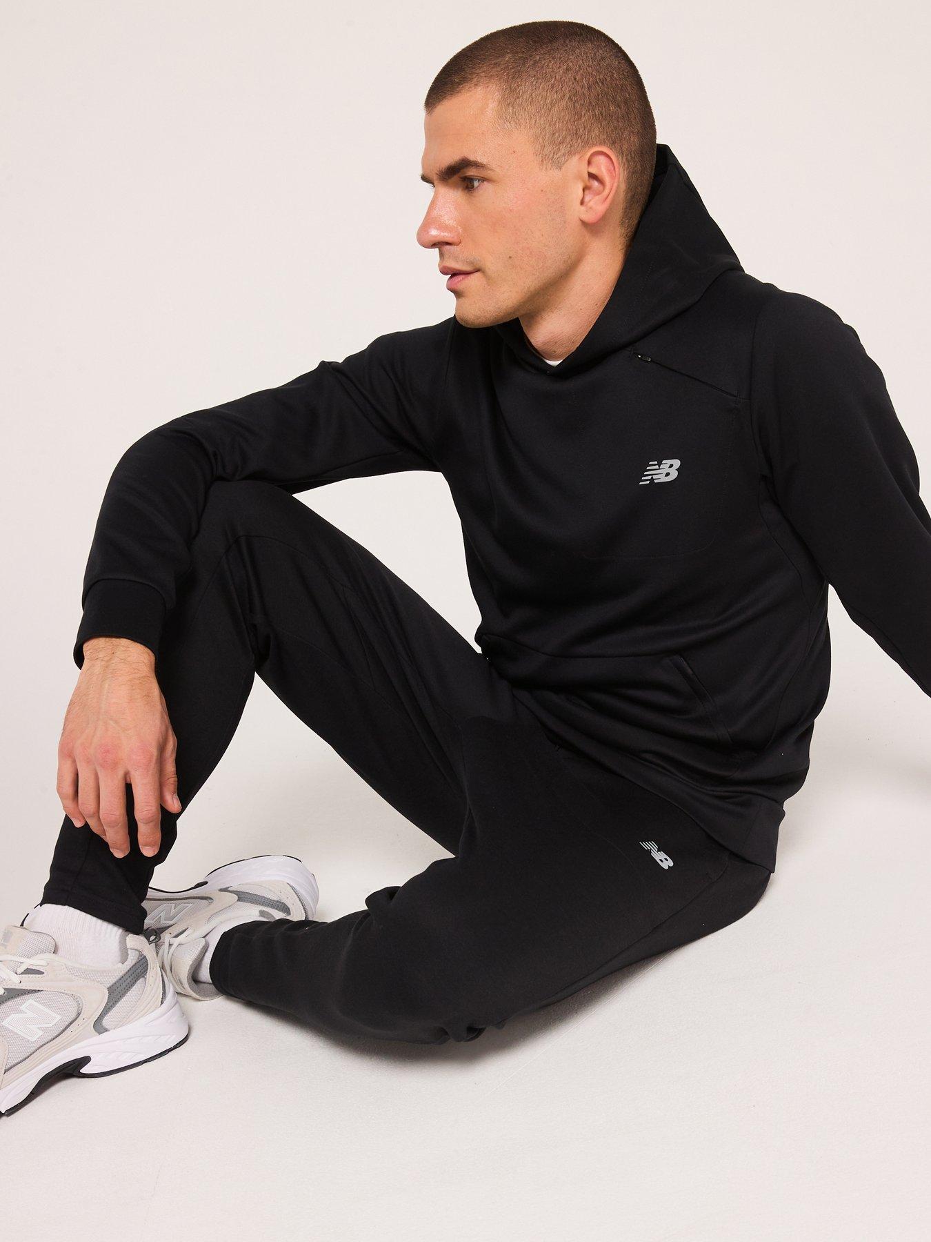  image of new-balance-mens-running-tech-knit-pants-black