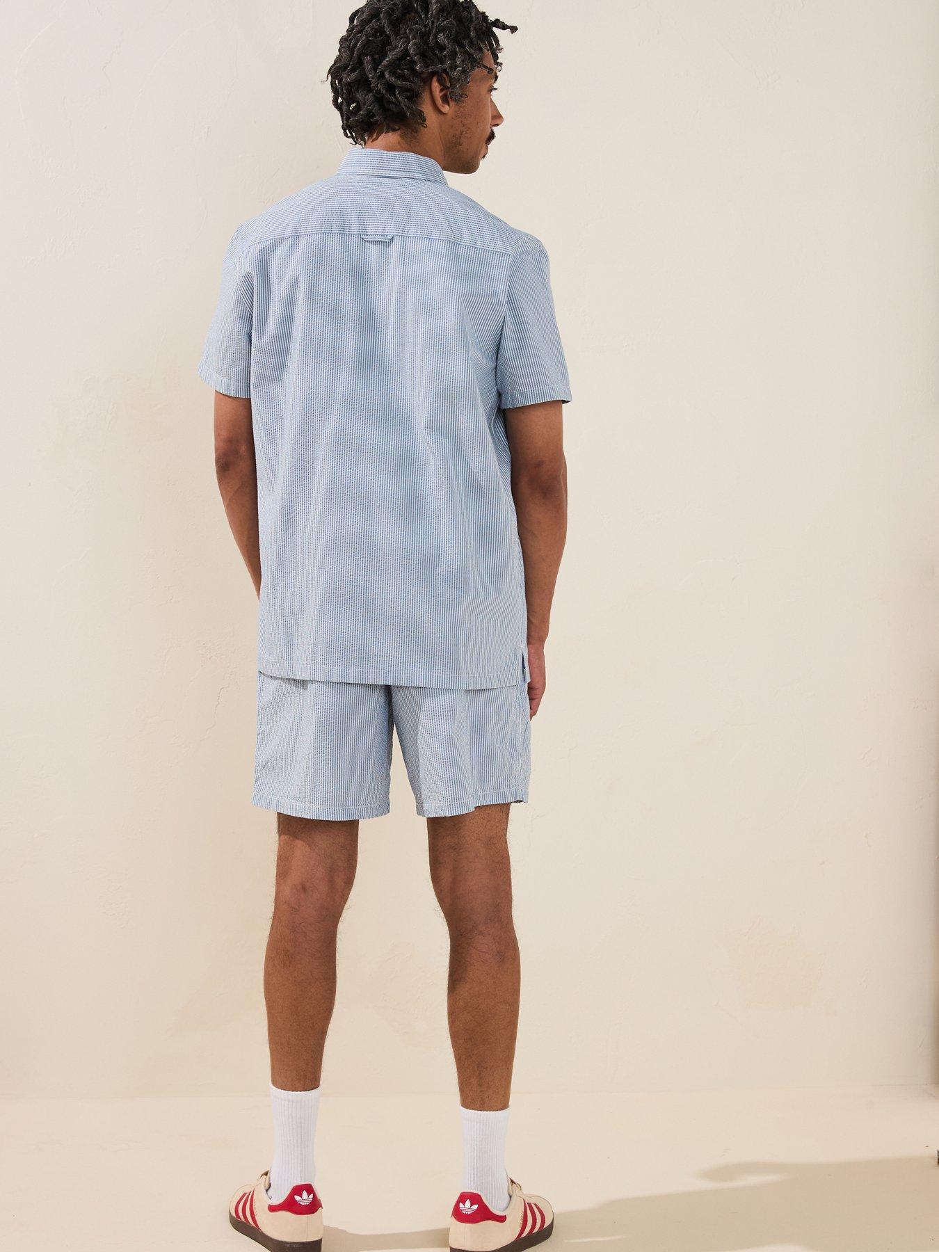  image of tommy-jeans-regular-stripe-seersucker-short-sleeve-shirt-light-blue