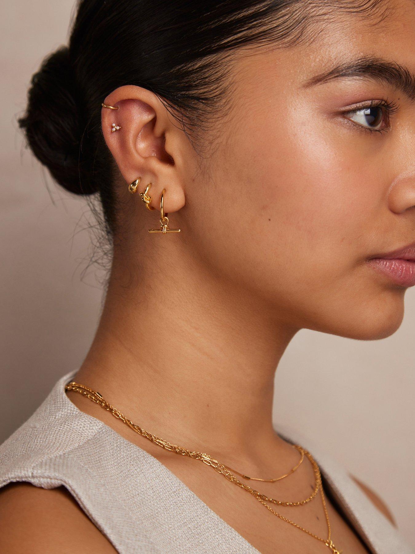Image 2 of 2 of Orelia Polished Knot Huggie Hoop Earrings