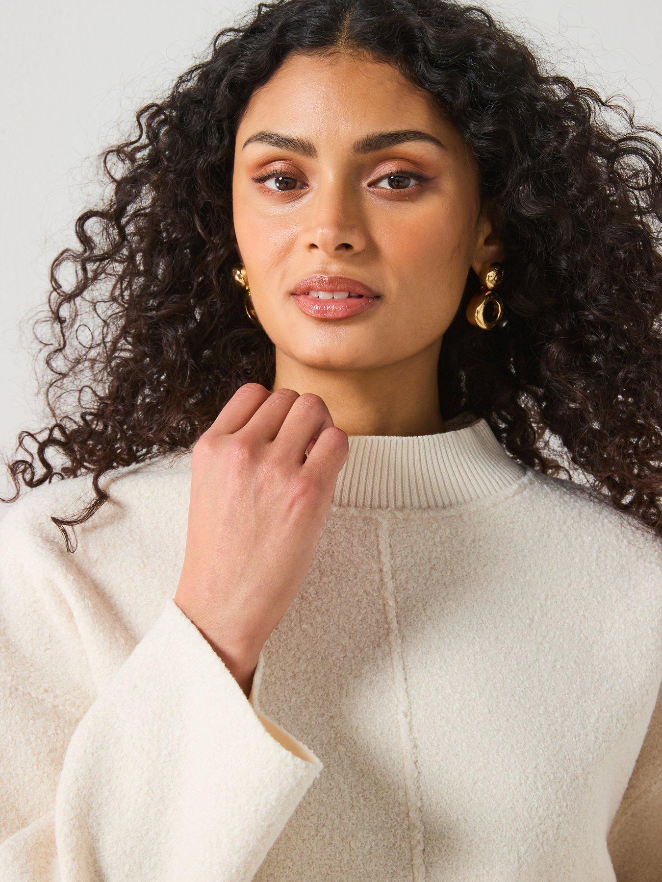  image of mango-perkins-neck-boucle-sweatshirt-cream
