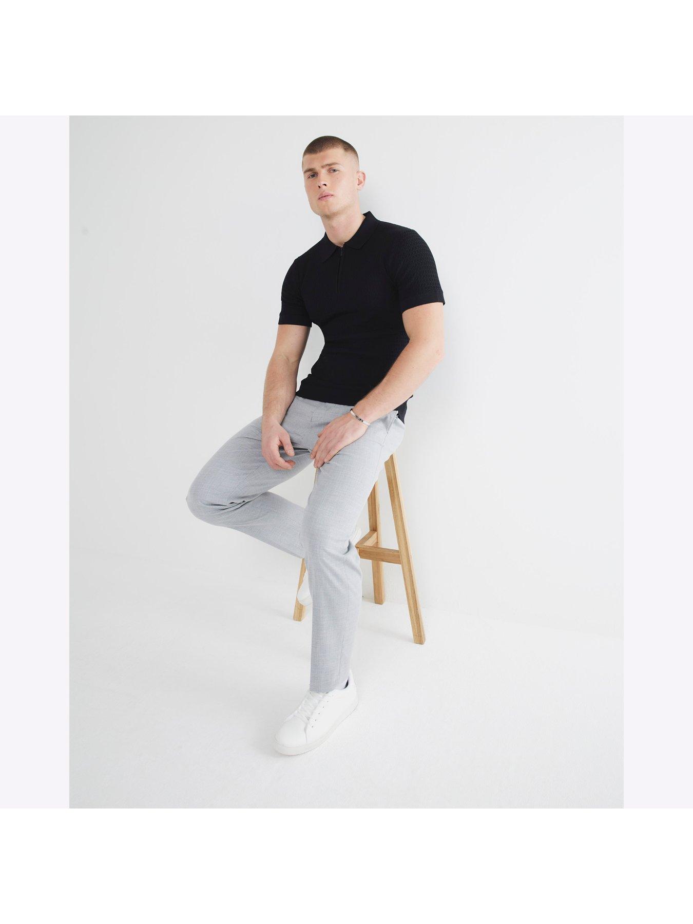  image of river-island-muscle-fit-textured-knitted-polo-shirt-black