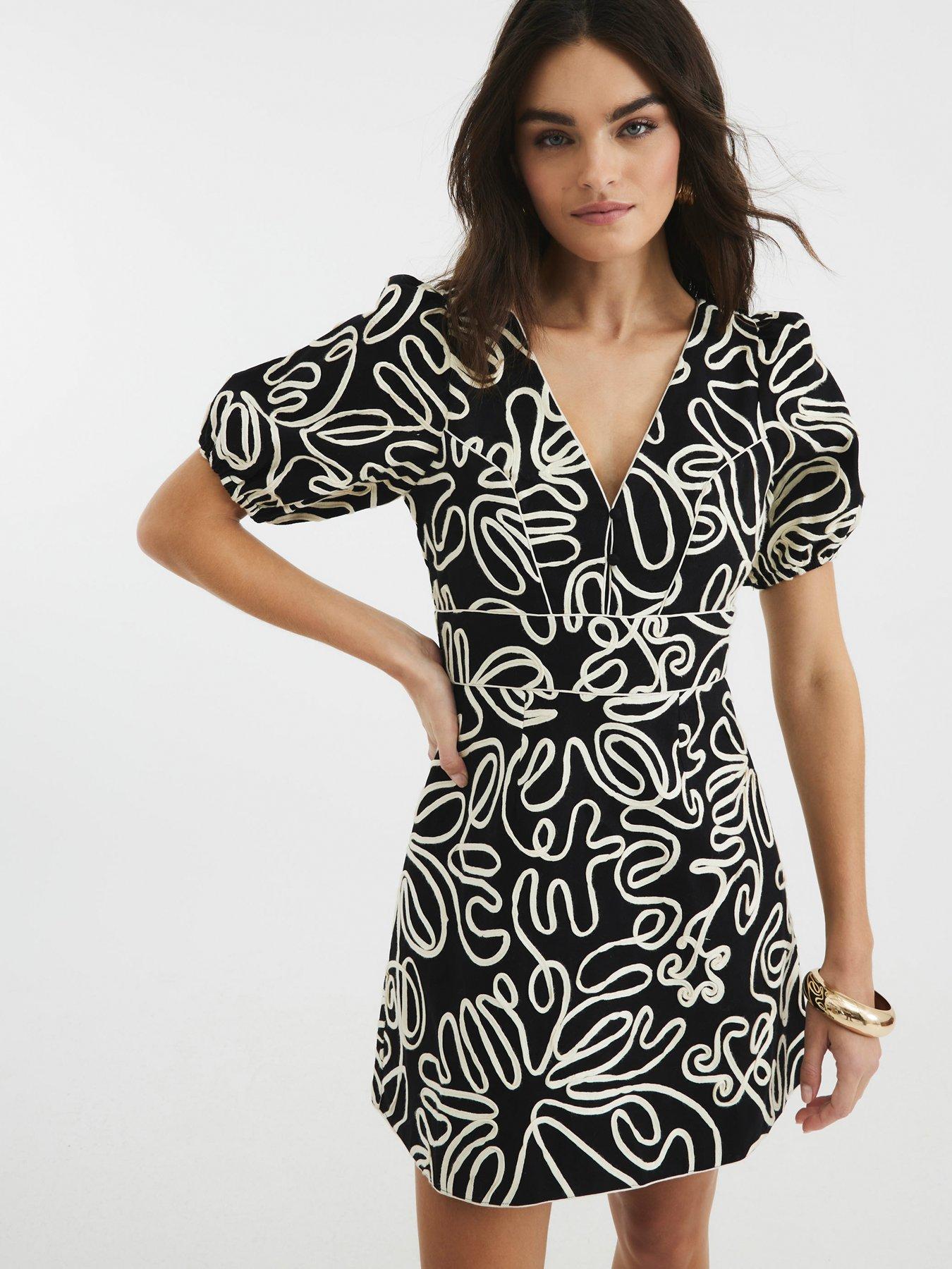 Image 1 of 4 of River Island Puff Sleeve Floral Mini Dress - Black