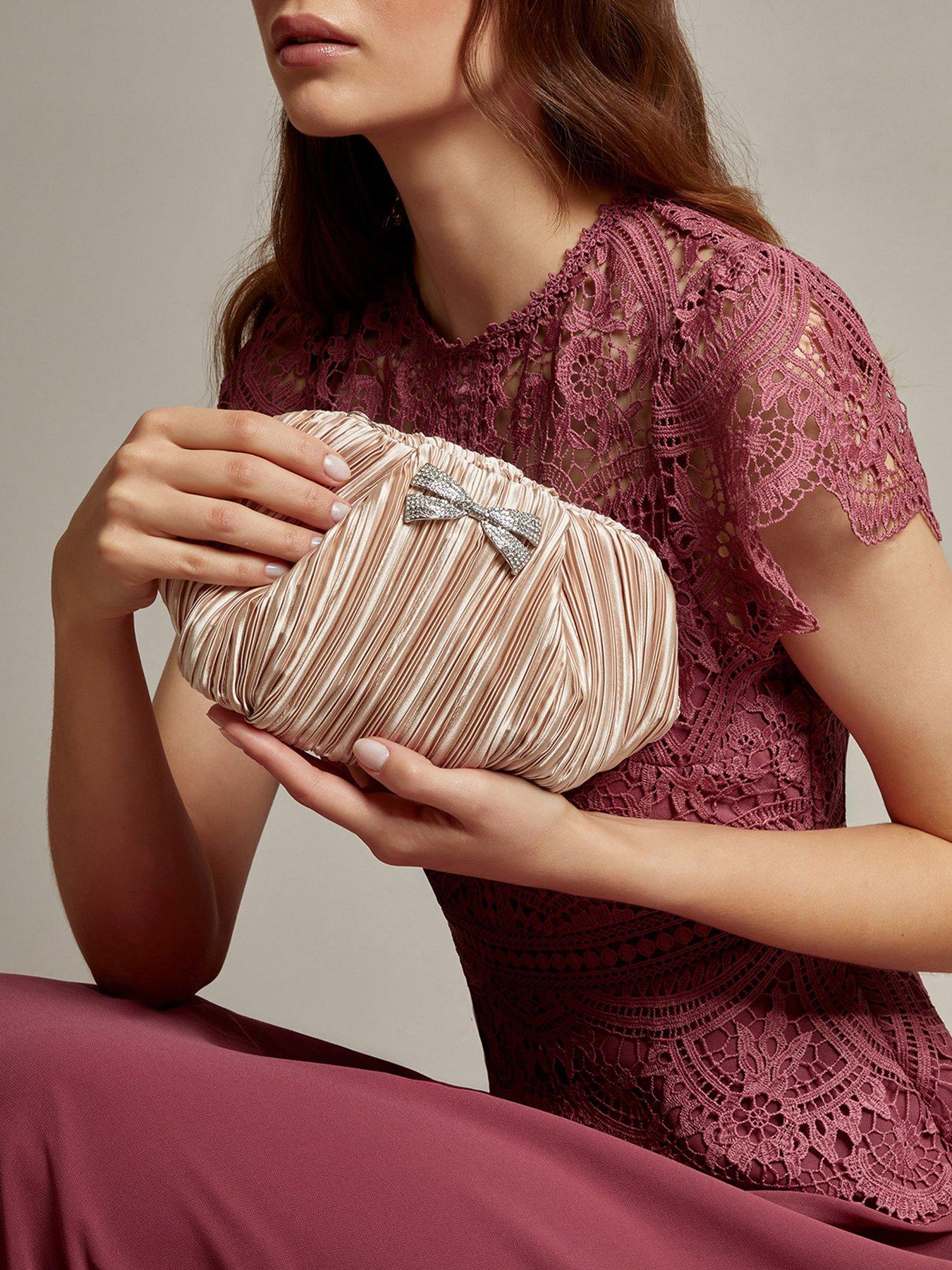  image of monsoon-pen-pleated-bow-clutch-pink