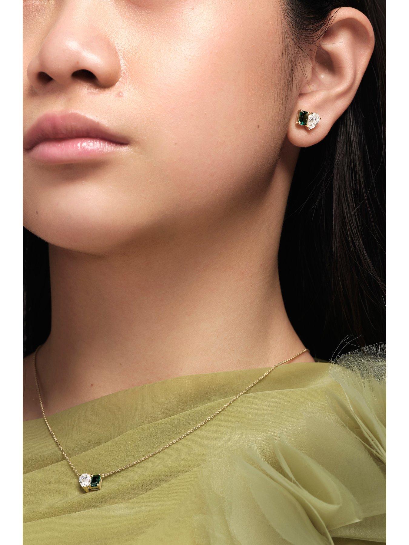  image of created-brilliance-unity-9ct-yellow-gold-130ct-tw-lab-grown-diamond-and-created-emerald-toi-et-moi-stud-earrings
