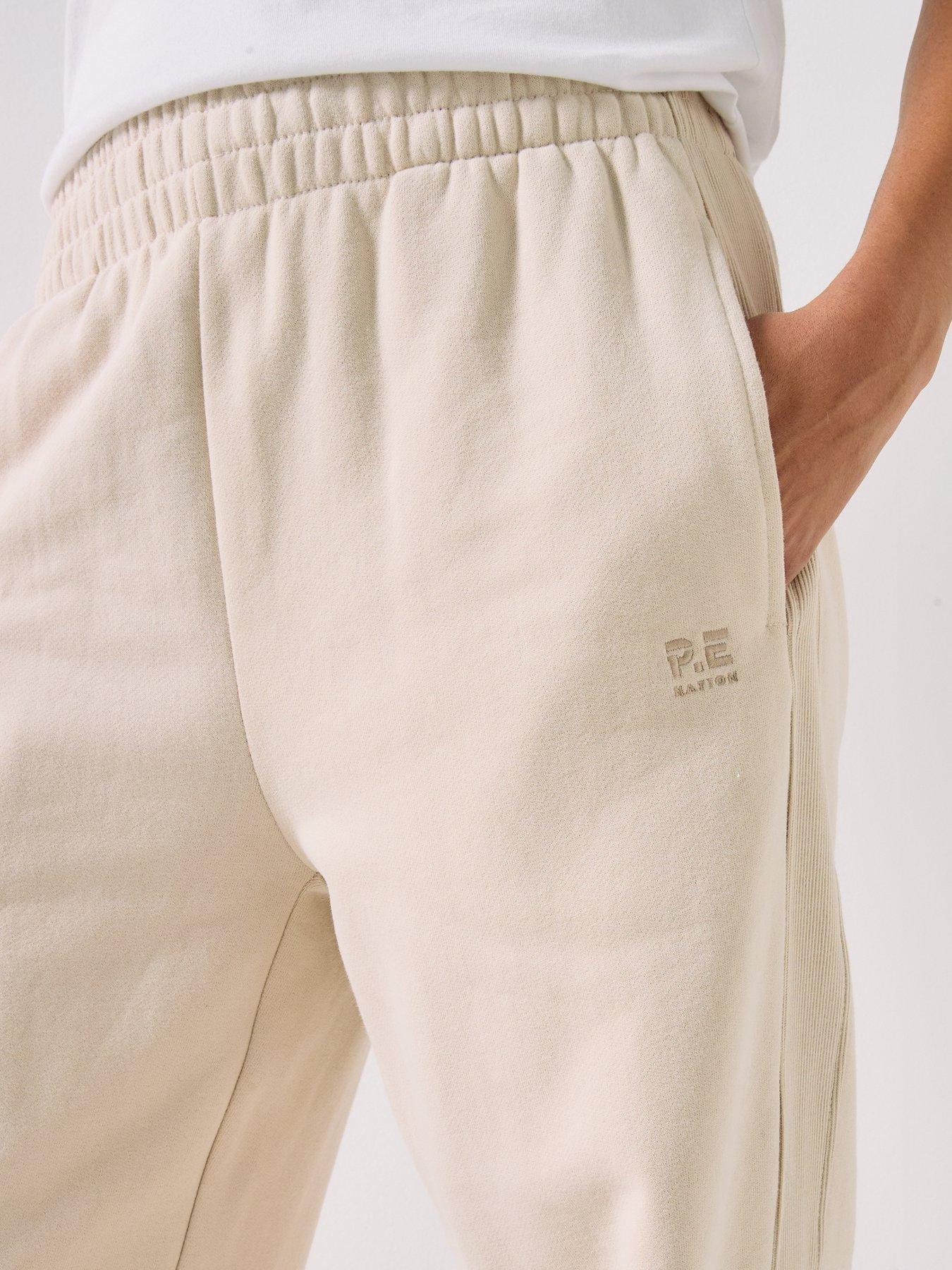  image of pe-nation-womens-training-adventure-trackpant-beige