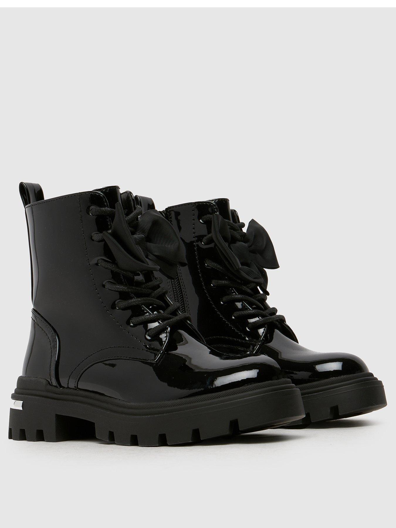  image of schuh-callie-bow-junior-patent-boot-black