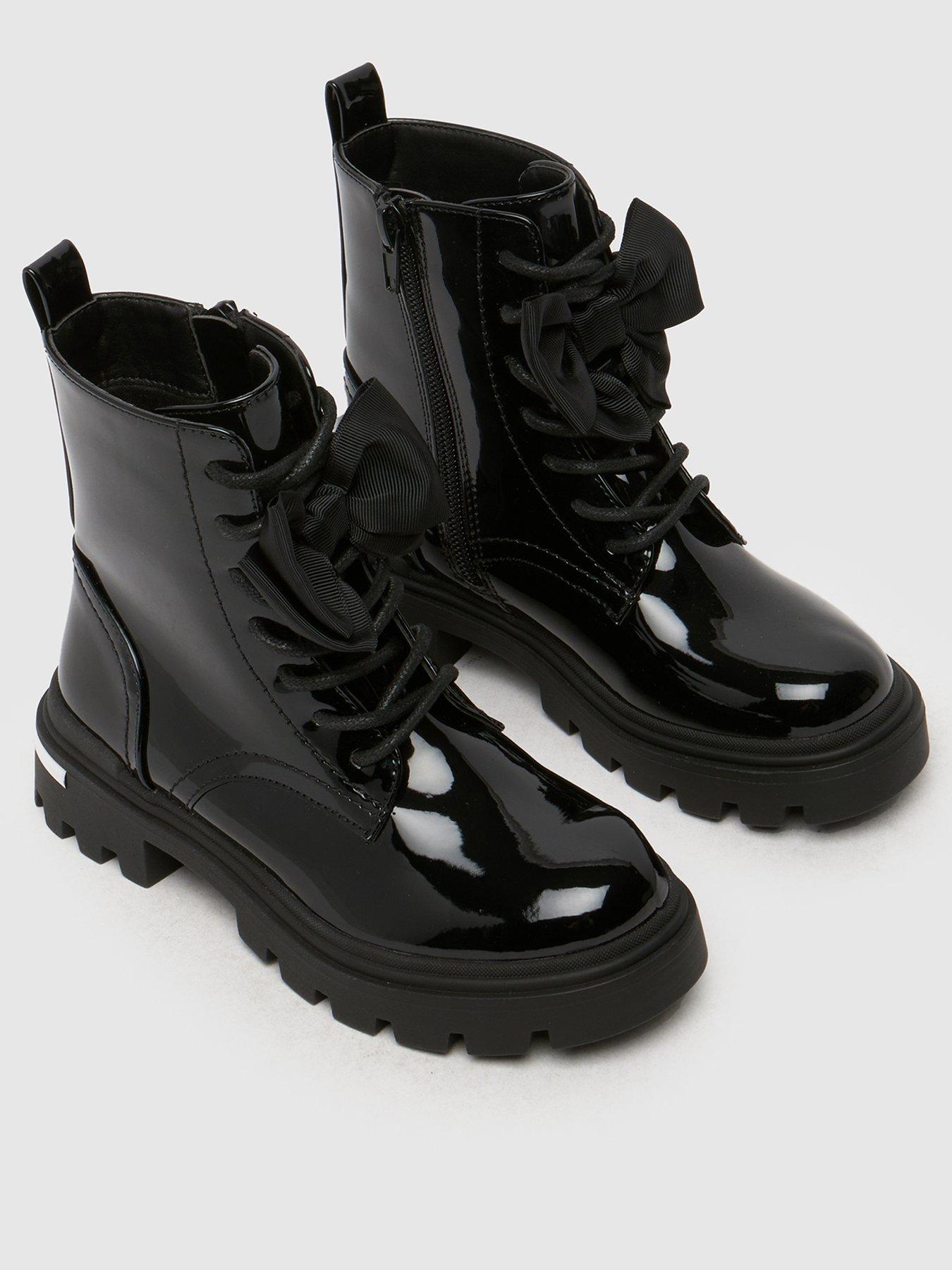  image of schuh-callie-bow-junior-patent-boot-black