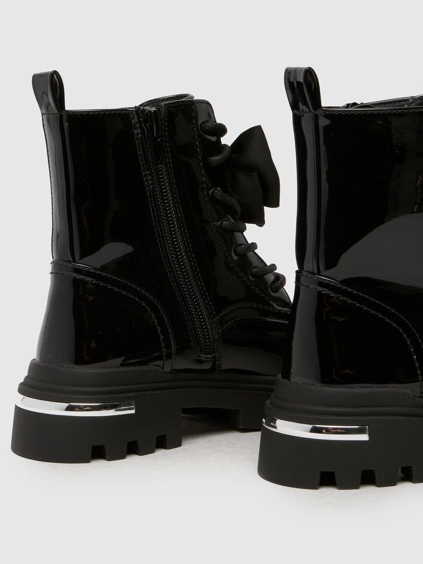  image of schuh-callie-bow-junior-patent-boot-black