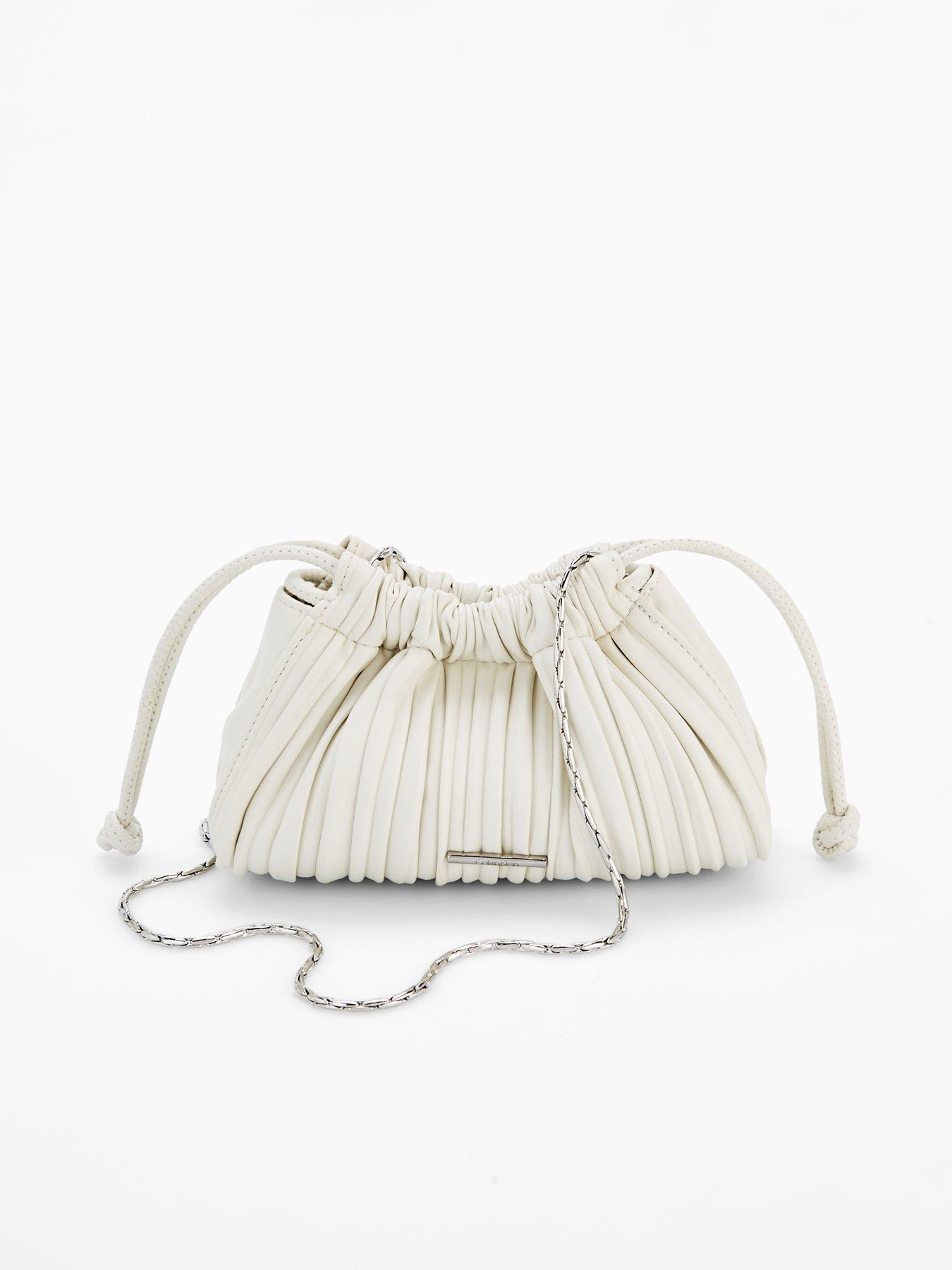 Image 1 of 4 of Calvin Klein Gathered Drawstring Crossbody Bag & White