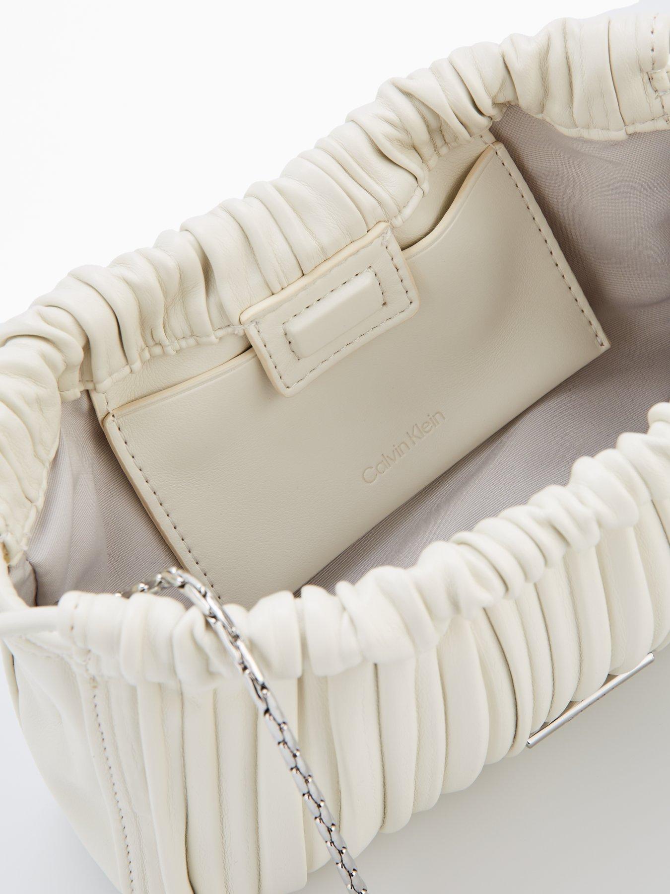 Image 4 of 4 of Calvin Klein Gathered Drawstring Crossbody Bag & White