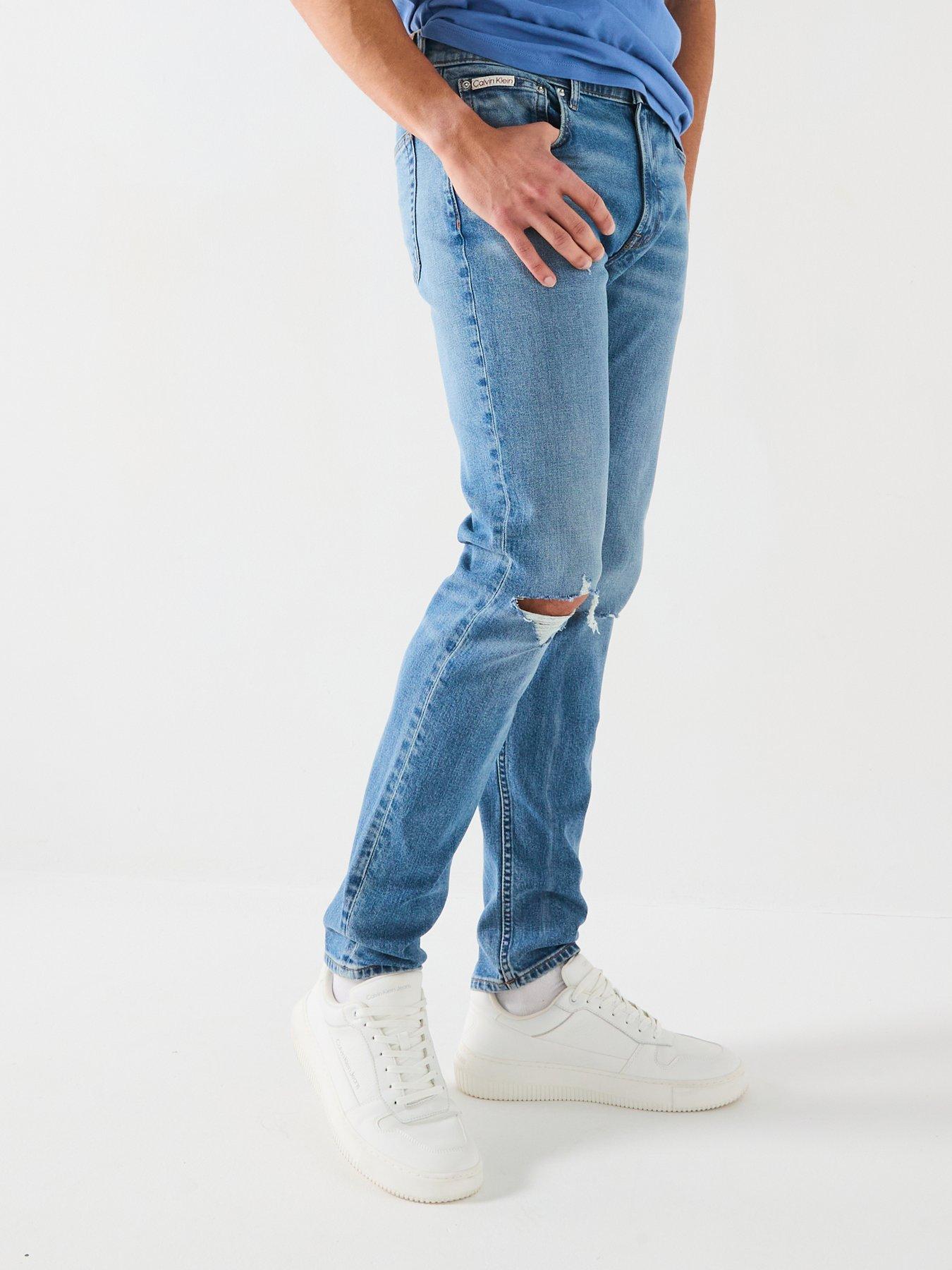 Image 1 of 6 of Calvin Klein Jeans Rip &amp; Repair Slim Taper Jeans - Mid Wash