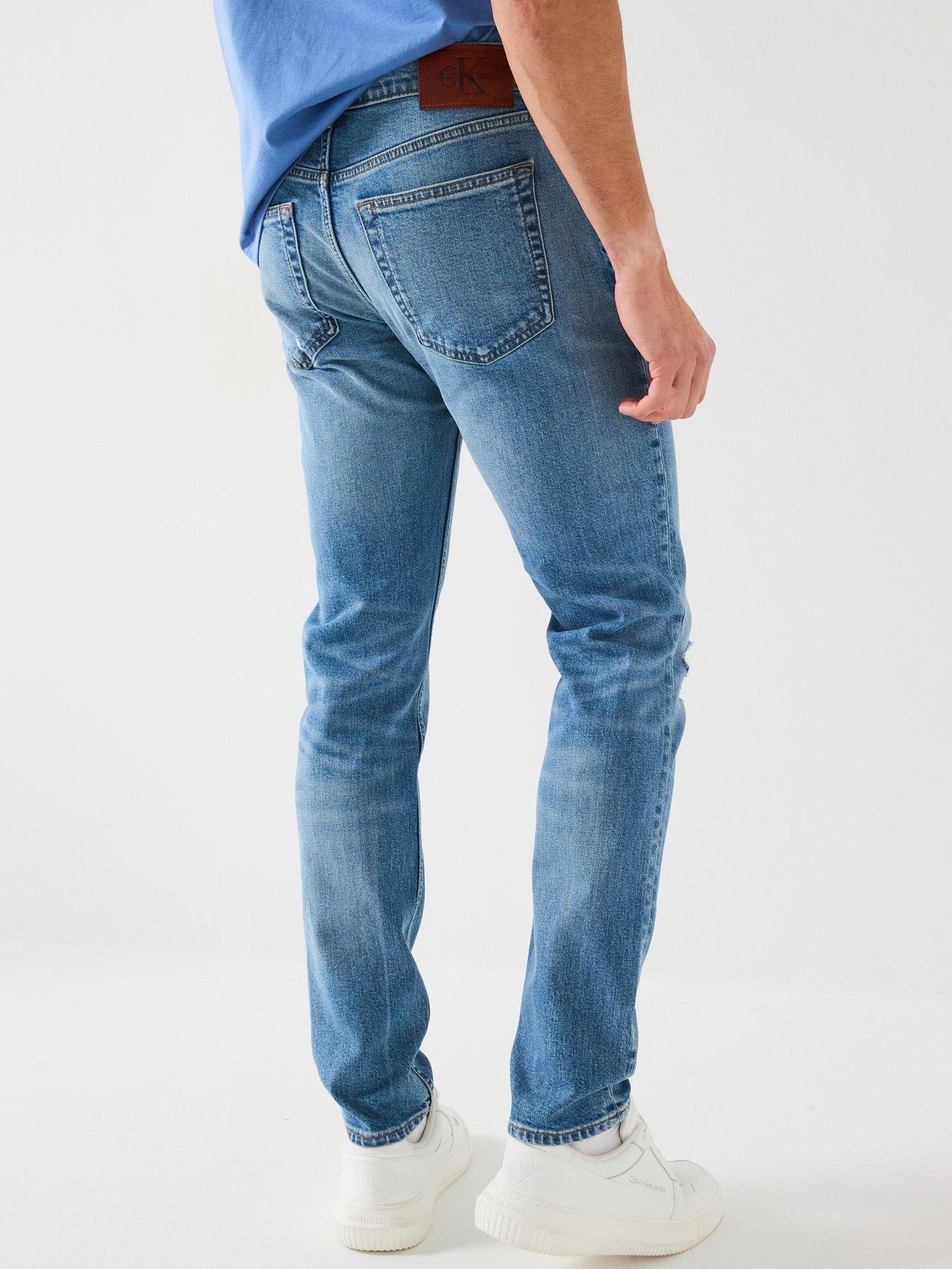 Image 2 of 6 of Calvin Klein Jeans Rip &amp; Repair Slim Taper Jeans - Mid Wash