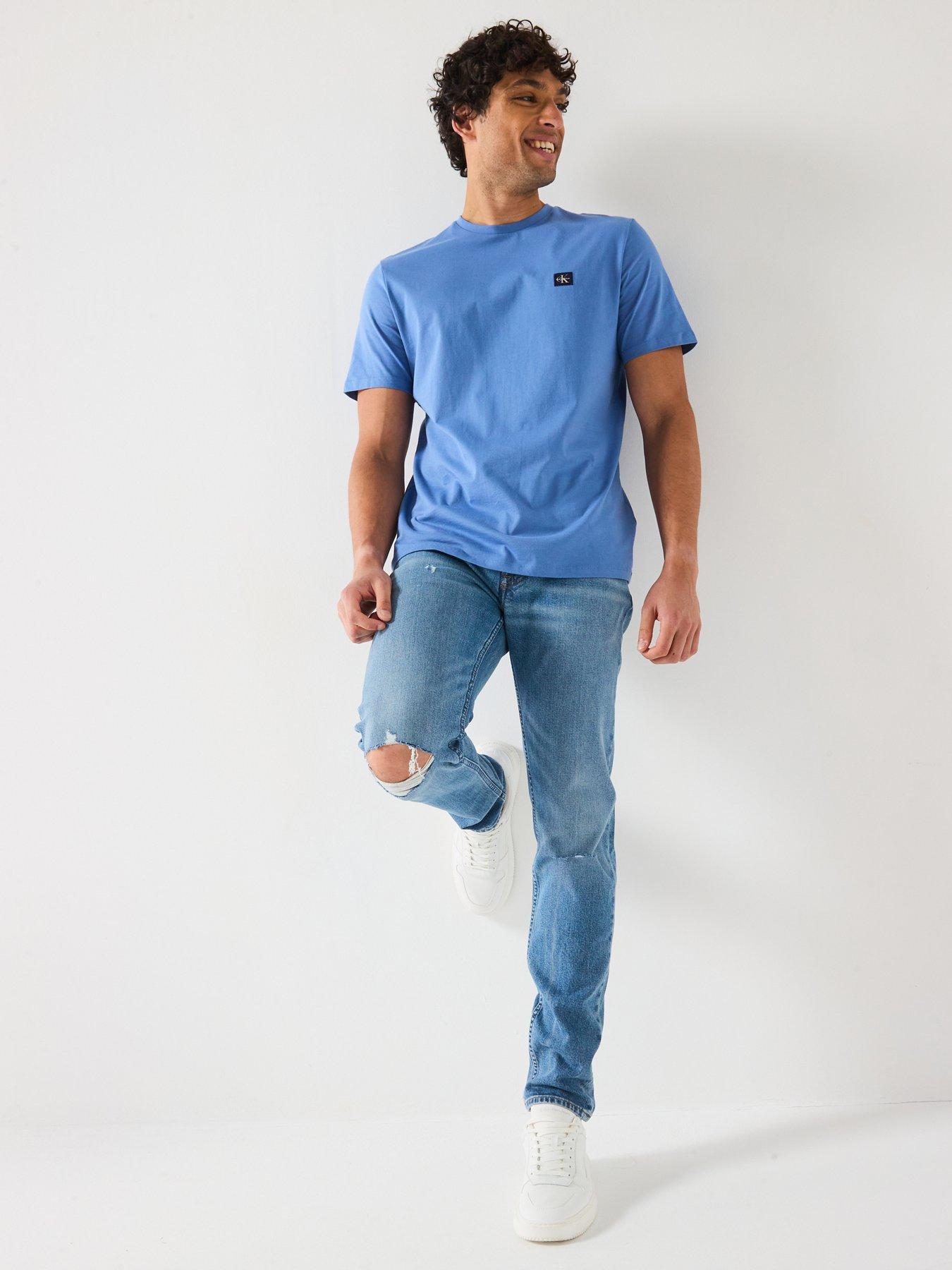 Image 3 of 6 of Calvin Klein Jeans Rip &amp; Repair Slim Taper Jeans - Mid Wash