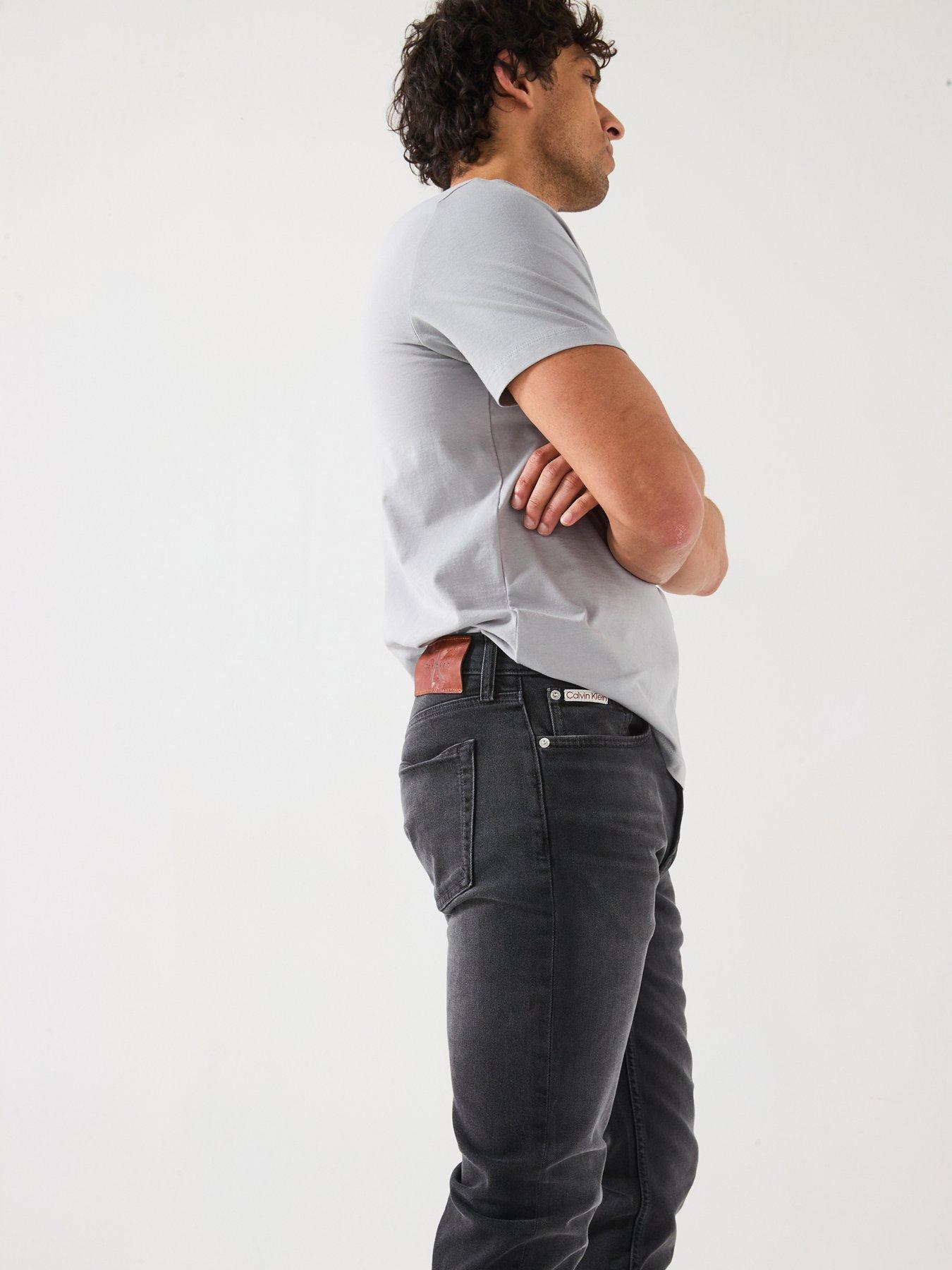 Image 5 of 6 of Calvin Klein Jeans Slim Taper Jeans - Black
