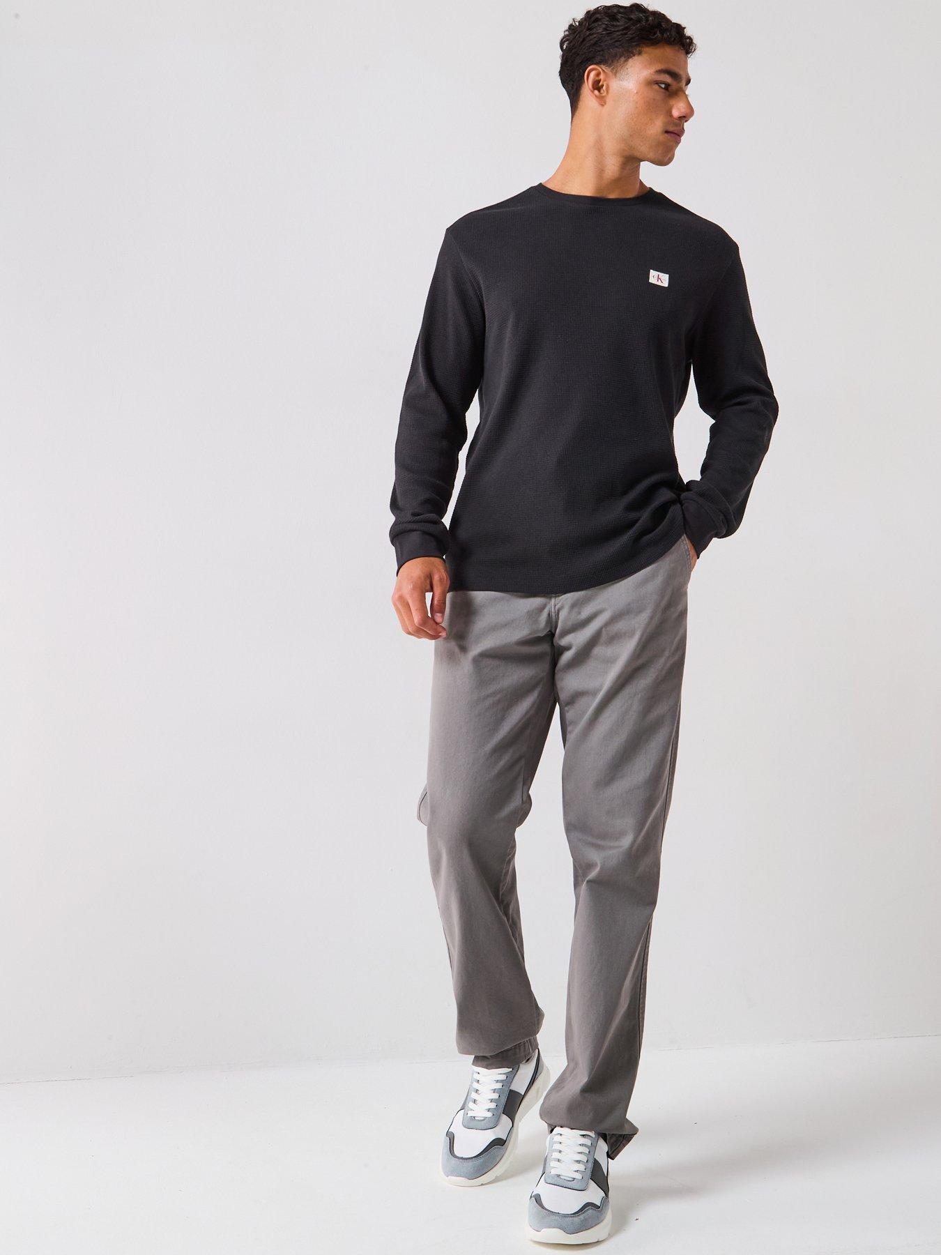  image of calvin-klein-jeans-left-chest-woven-badge-waffle-long-sleeve-t-shirt-black