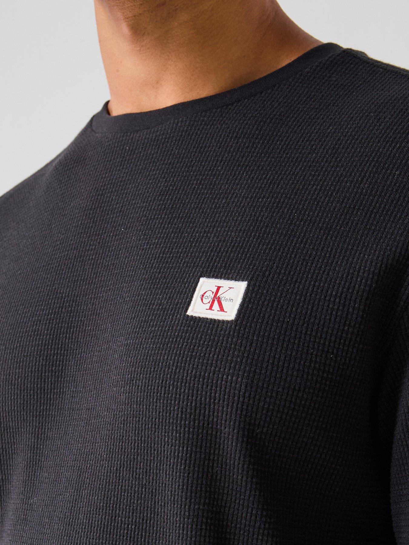  image of calvin-klein-jeans-left-chest-woven-badge-waffle-long-sleeve-t-shirt-black