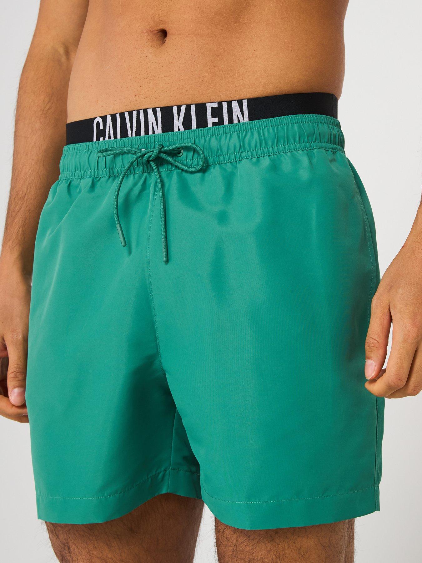  image of calvin-klein-medium-double-waistband-swimshorts-green