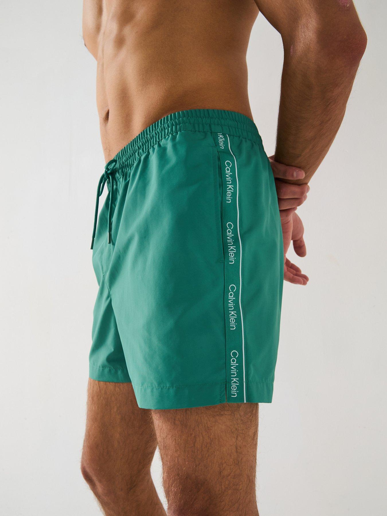 Image 4 of 6 of Calvin Klein Medium Taped Swimshorts - Green