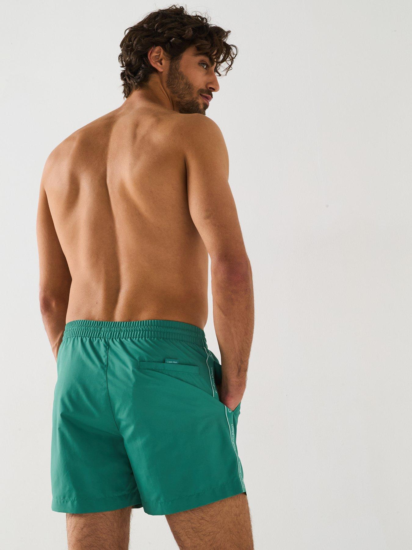 Image 6 of 6 of Calvin Klein Medium Taped Swimshorts - Green