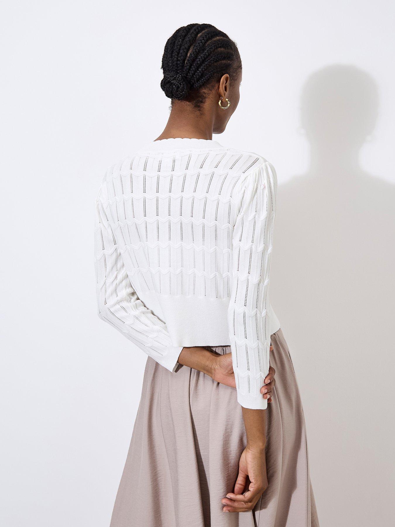  image of apricot-pointelle-chevron-shrug-cream