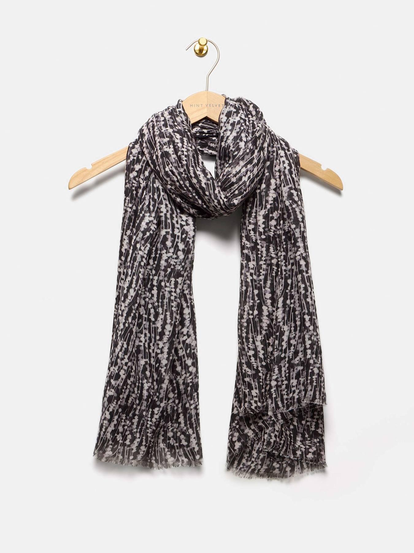  image of mint-velvet-graphic-print-lightweight-scarf-black