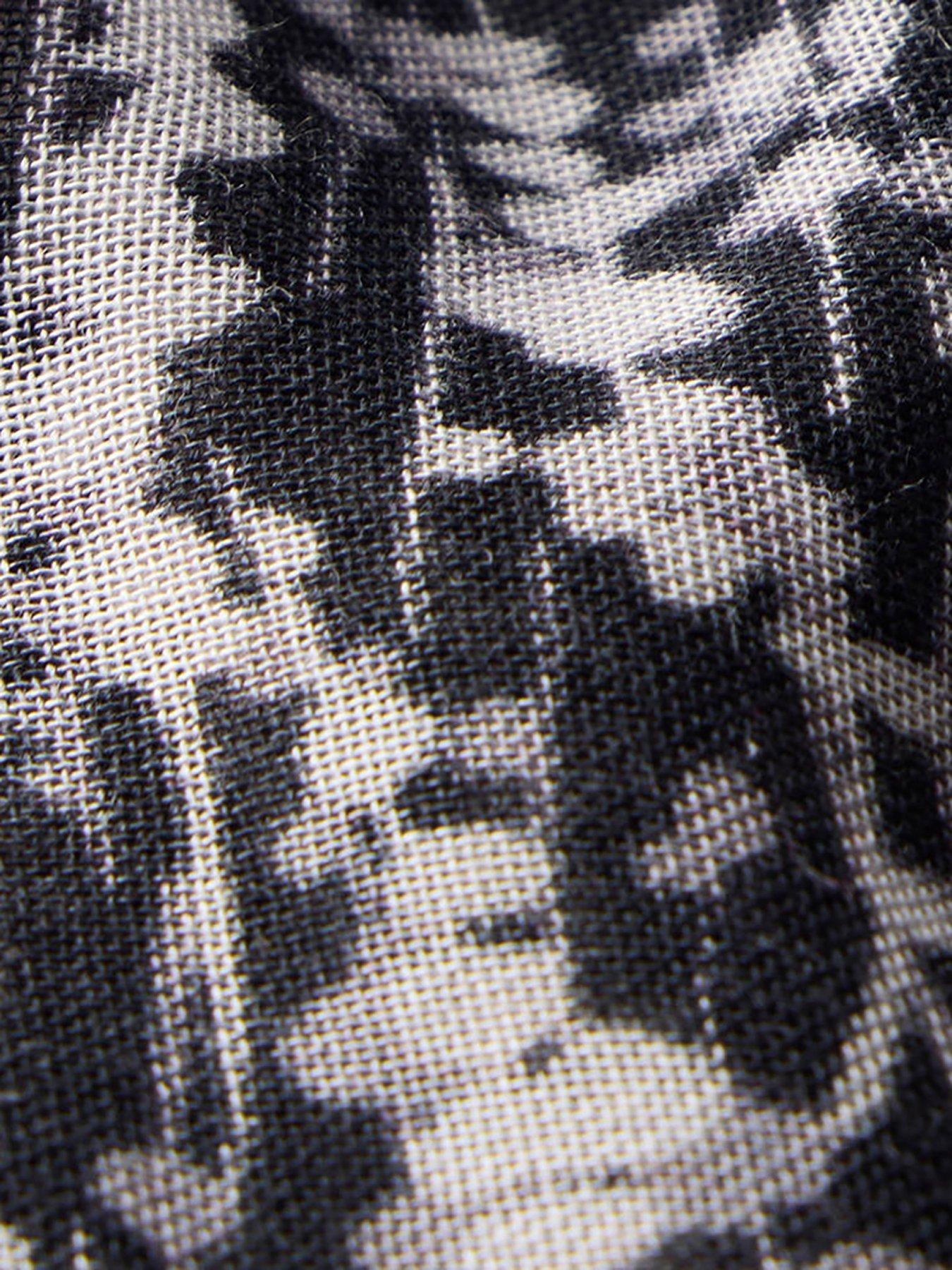  image of mint-velvet-graphic-print-lightweight-scarf-black